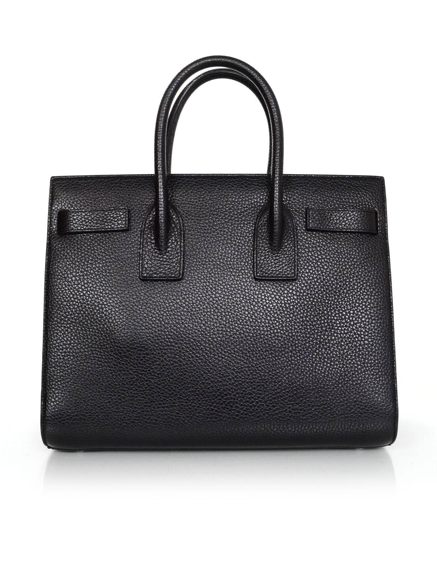 100% Authentic Saint Laurent Black Grained Calfskin Small Sac De Jour. Features accordion sides, embossed Saint Laurent signature on front of bag, and removable strap.

Made In: Italy
Color: Black
Hardware: Silvertone
Materials: Grained calfskin