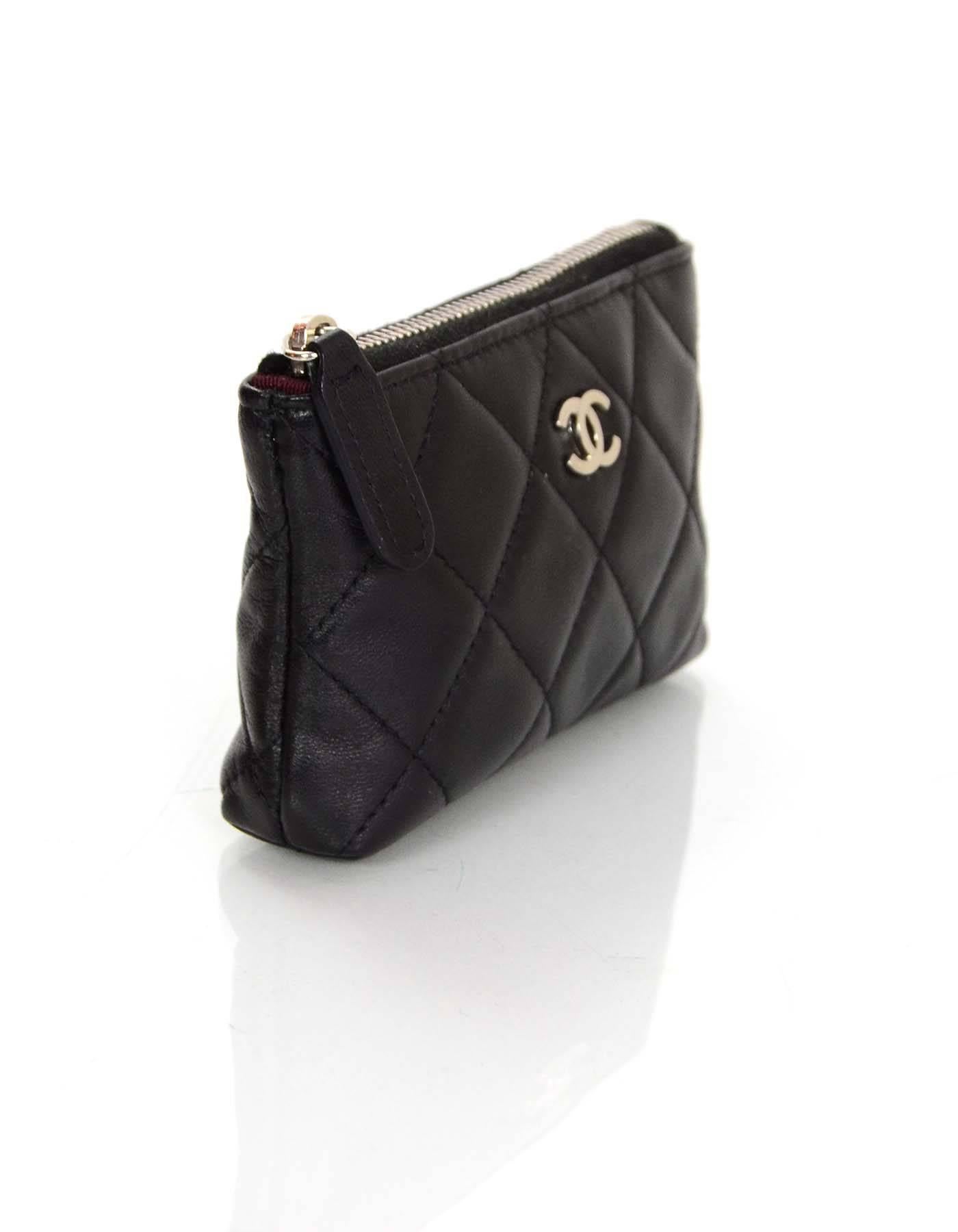 Chanel Black Quilted Coin Purse Key Ring

Made In: Italy
Year of Production: 2011
Color: Black
Hardware: Silvertone
Materials: Lambskin
Lining: Burgundy grosgrain
Closure/Opening: Zip across top
Overall Condition: Excellent pre-owned