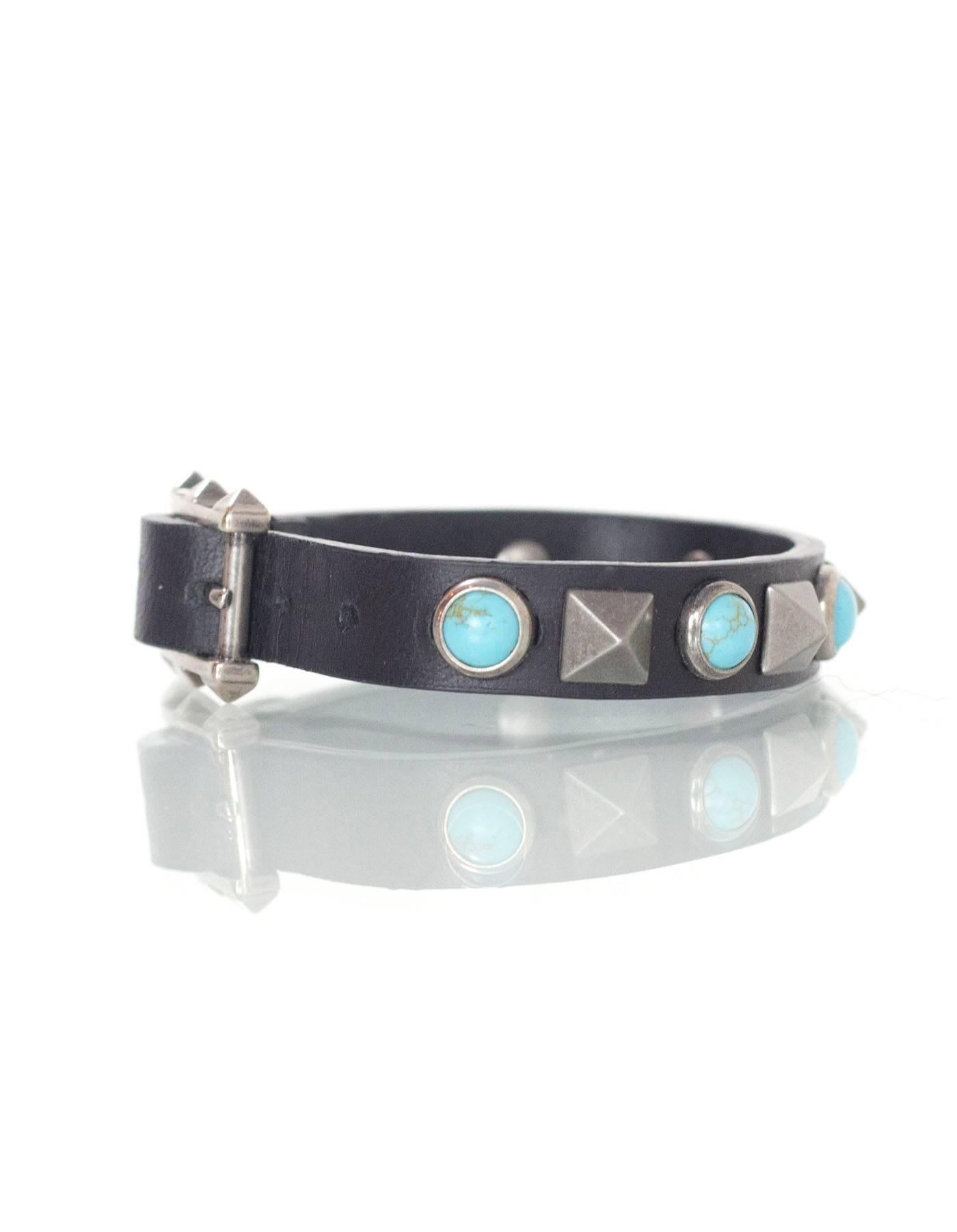 Valentino Black Leather & Turquoise Stone Wrap Bracelet
Features turquoise stones and silver rockstuds throughout

Made In: Italy
Color: Black, silver and turquoise
Materials: Leather, metal and stone
Closure/Opening: Buckle and notch