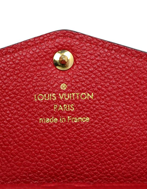 Red Louis VUITTON Monogram Empreinte Key Pouch.