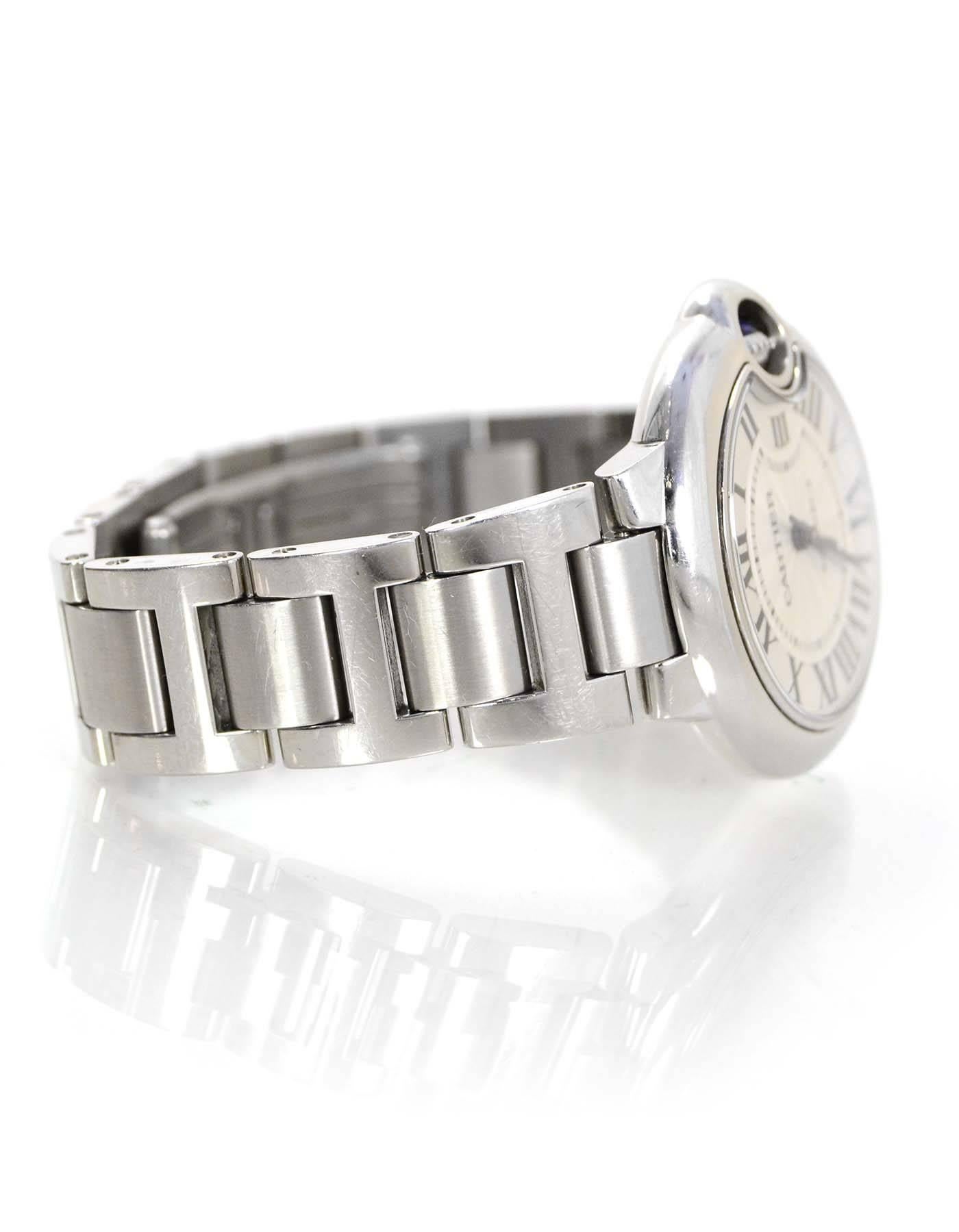 Cartier Stainless Steel 33mm Ballon  Bleu De Cartier Watch 

Made In: Switzerland
Color: Silver
Materials: Stainless steel
Movement: Automatic
Closure/Opening: Double hinge watch closure
Serial Number: 110861UX
Retail Price: $5,750 + tax
Overall