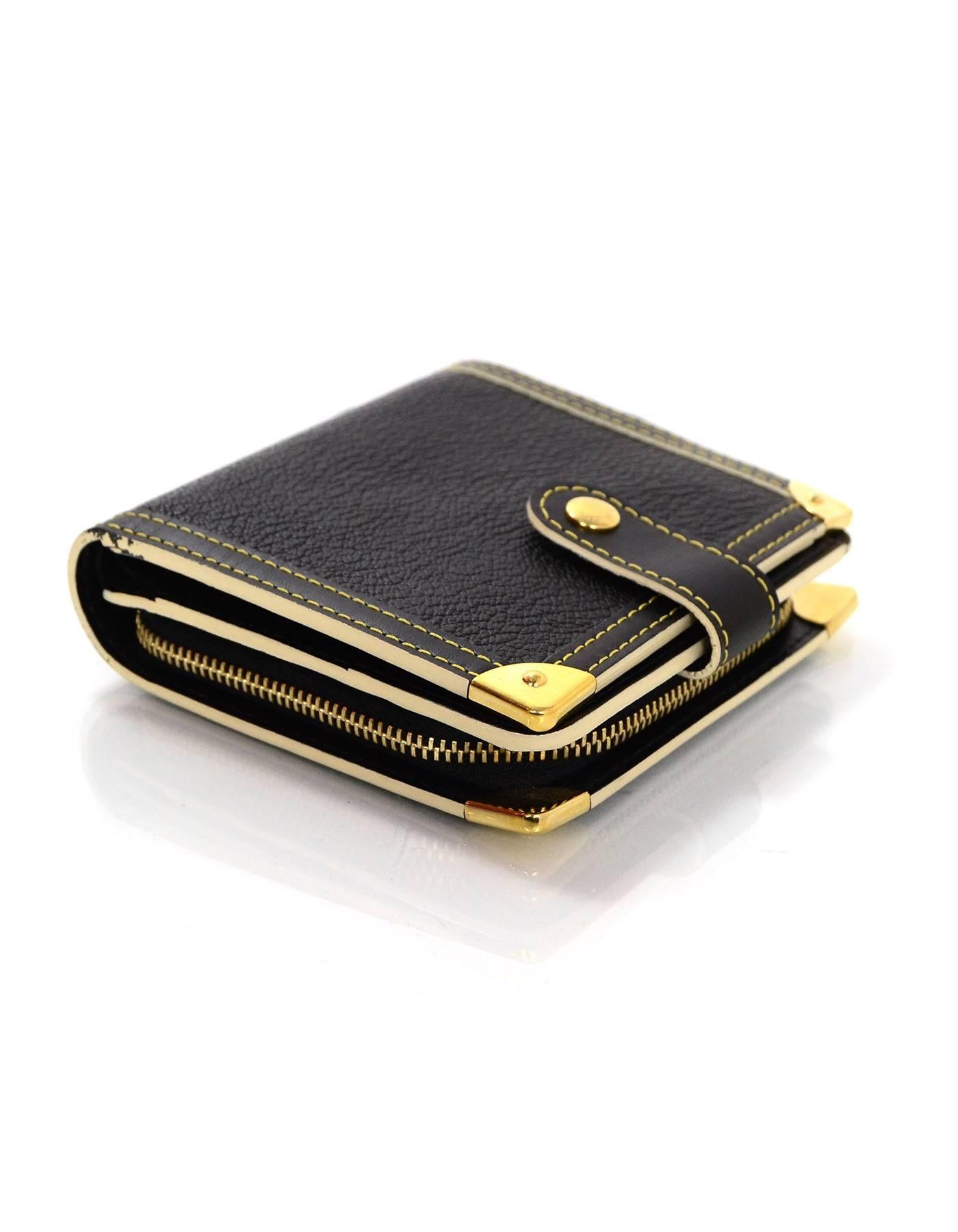 Louis Vuitton Black Leather Suhali Wallet

Made In: France
Year of Production: 2004
Color: Black, gold
Hardware: Goldtone
Materials: Leather
Lining: Black leather
Closure/Opening: Bi fold with snap closure
Exterior Pockets: None
Interior Pockets: