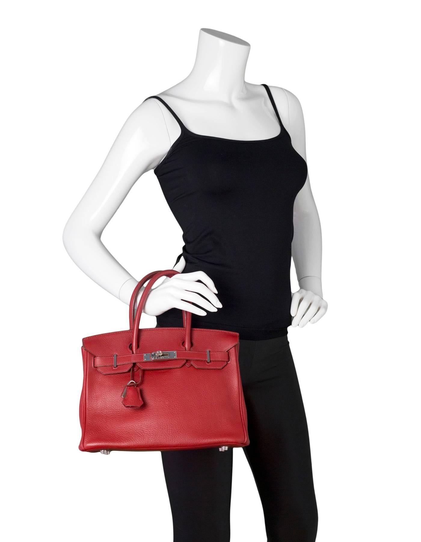 Hermes Red Clemence Leather 30cm Birkin Bag

Made In: France
Year of Production: 2007
Color: Red
Hardware: Palladium
Materials: Clemence leather
Lining: Red leather
Closure/Opening: Flap top with two leather arms that come to center for twist