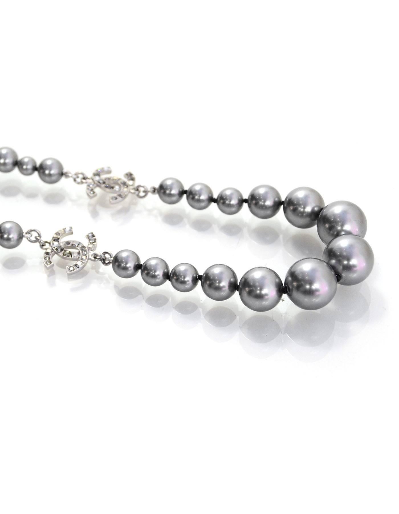 Chanel Grey Graduated Pearl & CC Choker Necklace
CC Pendants feature grey and clear crystals throughout

Made In: France
Year of Production: 2015
Color: Grey and silvertone
Materials: Metal, faux pearl and crystal
Closure: Lobster claw clasp
Stamp: