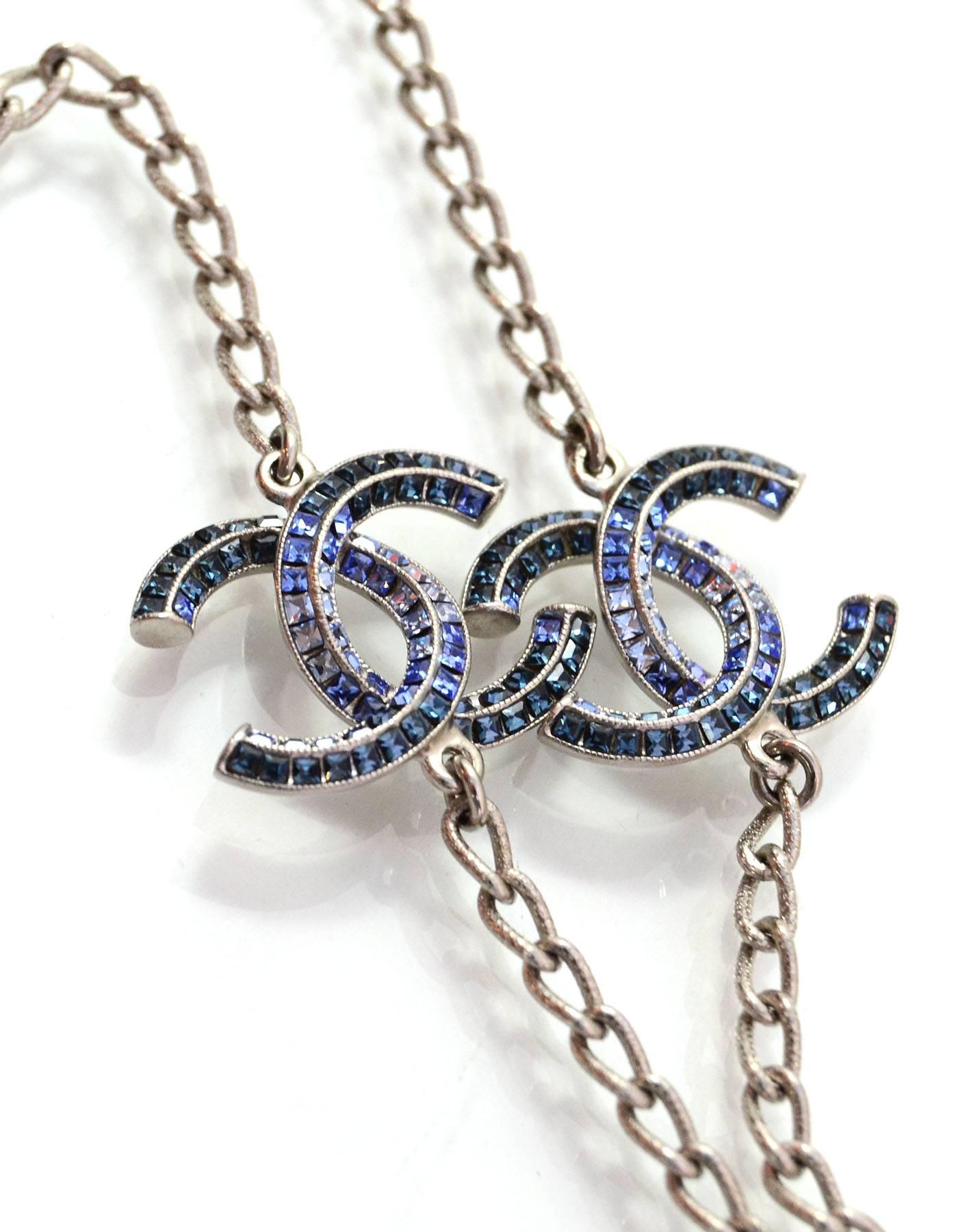 100% Authentic Chanel Long Silver Chain Link & Crystal CC Necklace.  Two CC Pendants feature blue ombre baguette crystals.

Made In: France
Year of Production: 2015
Color: Silvertone, green and blue
Materials: Metaland crystal
Closure: Lobster claw