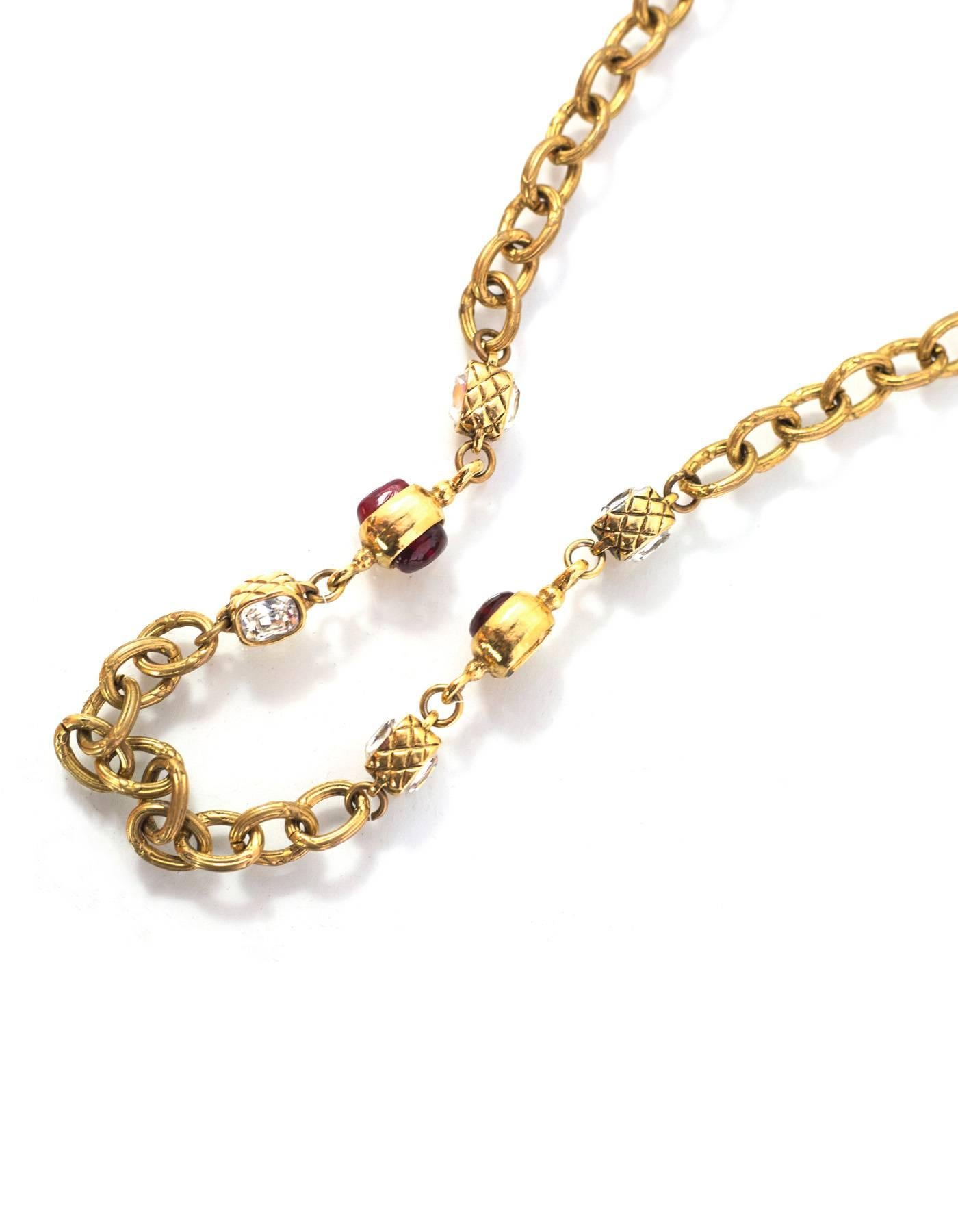 Chanel Vintage Gold Chain Link & Red Gripoix Necklace
Features square crystals with quilted goldtone framing

Made In: France
Year of Production: 1986
Color: Goldtone, red, and clear
Materials: Metal, poured glass and crystal
Closure: Push lever