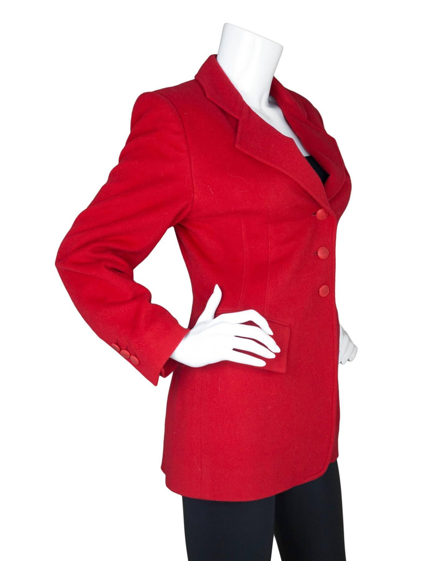 Hermes Red Cashmere Riding Jacket 
Features matching red buttons with H's on them

Made In: France
Color: Red
Composition: 100% cashmere
Lining: Red, 100% acetate
Closure/Opening: Button down front
Exterior Pockets: One breast pockets and two hip