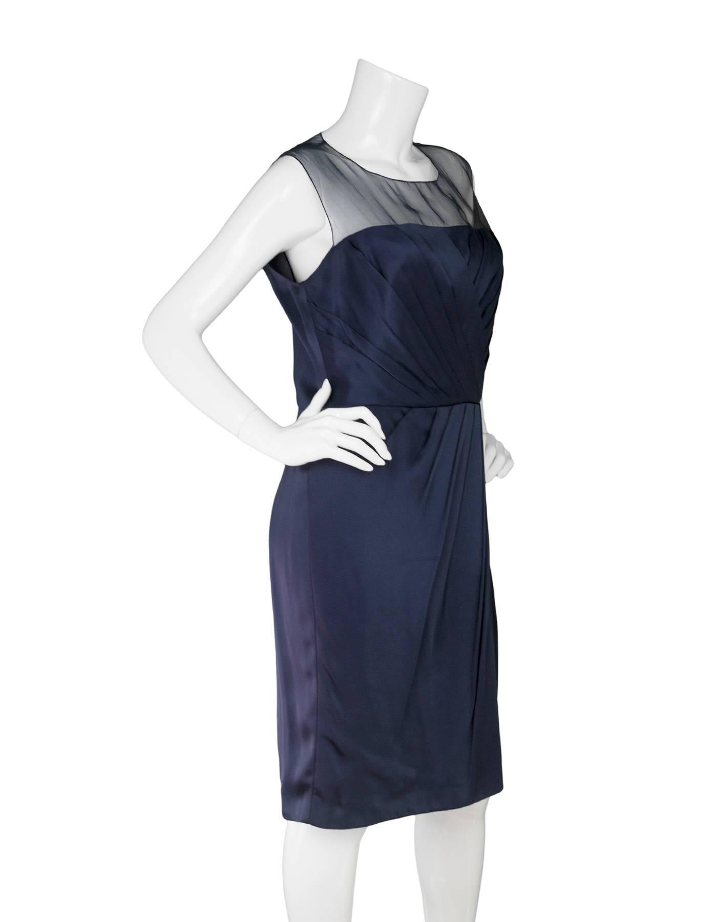 Andrew GN Navy Cocktail Dress 
Features sheer neckline and shoulders

Made In: France
Color: Navy
Composition: 64% acetate, 30% viscose, 6% silk
Lining: Navy, silk-blend
Closure/Opening: Back zip up with buttons at neckline
Exterior Pockets: