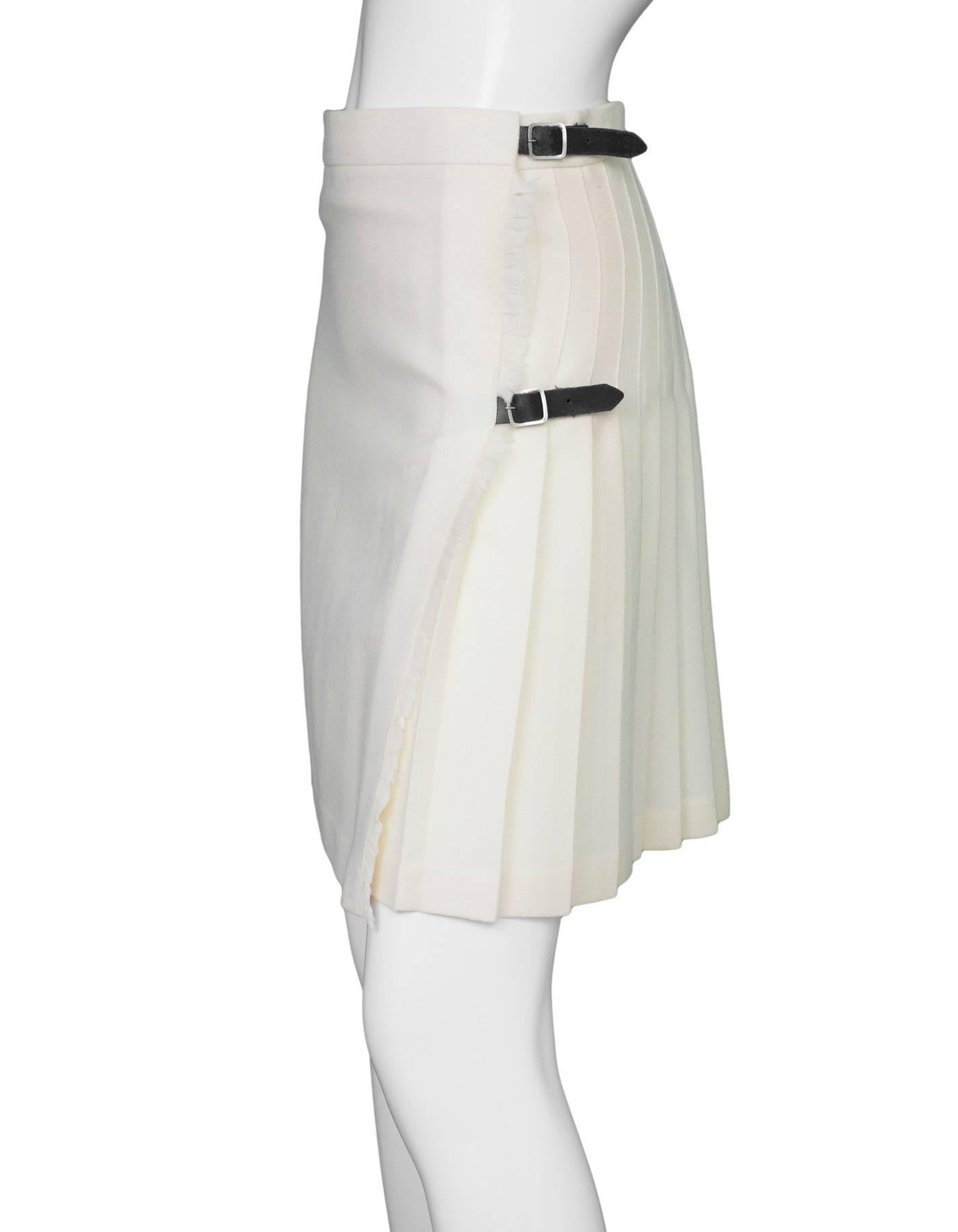 Burberry Ivory Wool Pleated Wrap Skirt 
Features black leather side buckles

Made In: Scotland
Color: Ivory and black
Composition: Not given- believed to be 100% wool
Lining: None
Closure/Opening: Wrap waist with inside button and exterior