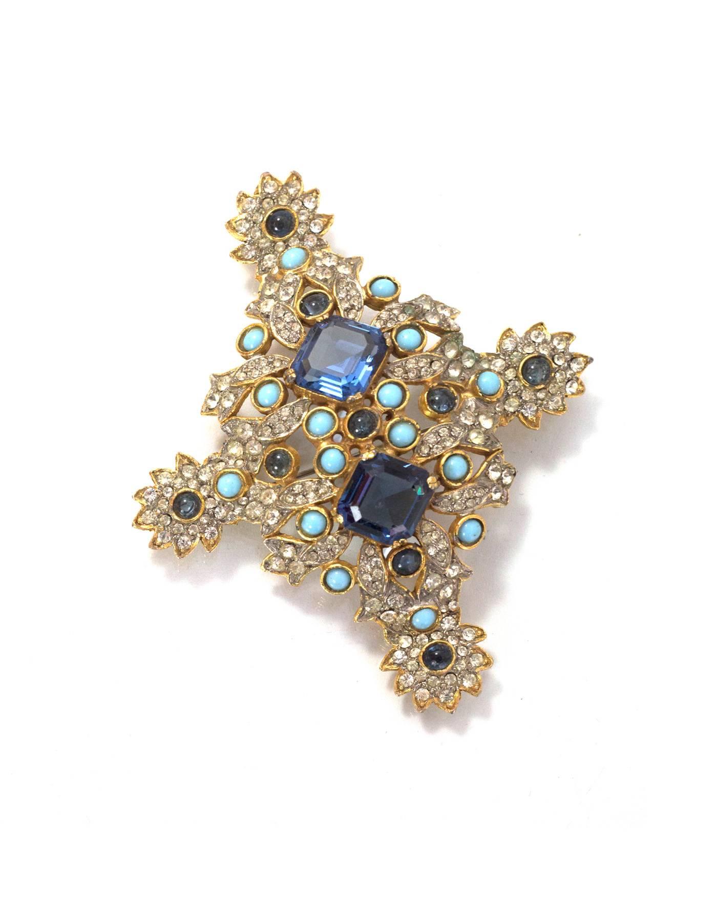 Kenneth Jay Lane Blue & Gold Crystal Brooch
Features hook on back for wearing as a pendant on necklace

Color: Dark blue, light blue, clear and goldtone
Materials: Crystals, stone and metal
Closure/Opening: Pin back closure
Stamp: KJL
Overall