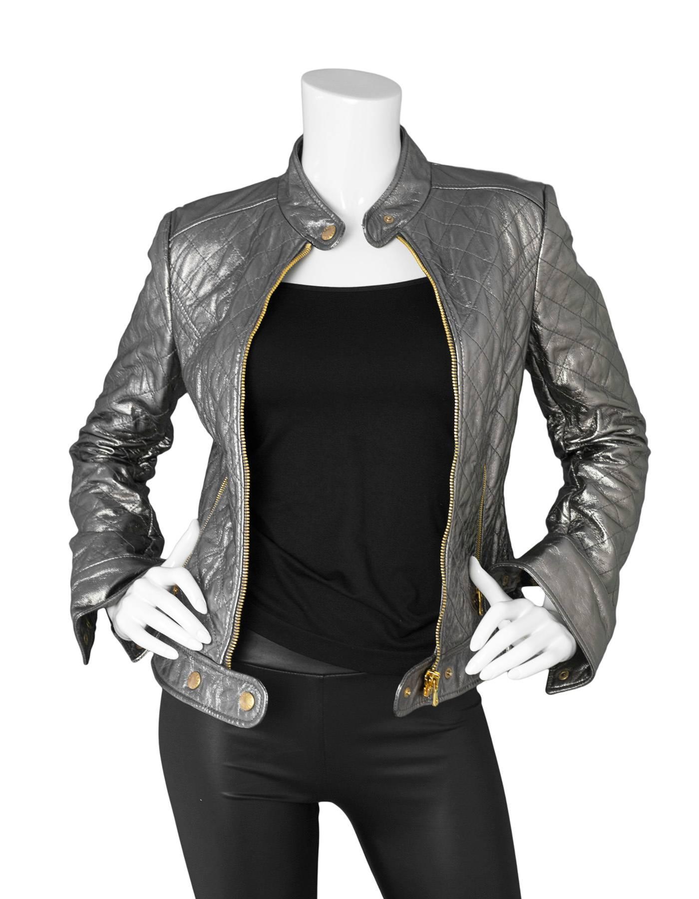 Dolce & Gabbana Quilted Metallic Leather Jacket

Made In: Italy
Color: Metallic
Composition: Not given- believed to be 100% Leather
Lining: Leopard print quilted textile
Closure/Opening: Zip up front
Exterior Pockets: Two hip zipper