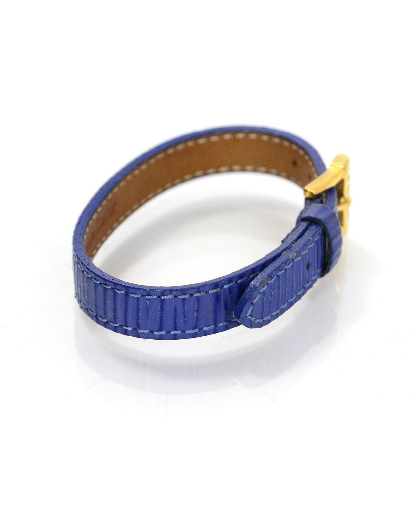 Fendi Blue Textured Leather Wrap Bracelet

Color: Blue
Hardware: Goldtone
Materials: Textured leather and metal
Closure: Buckle and notch closure
Stamp: Fendi 10 Genuine Leather
Overall Condition: Excellent pre-owned condition with the exception of