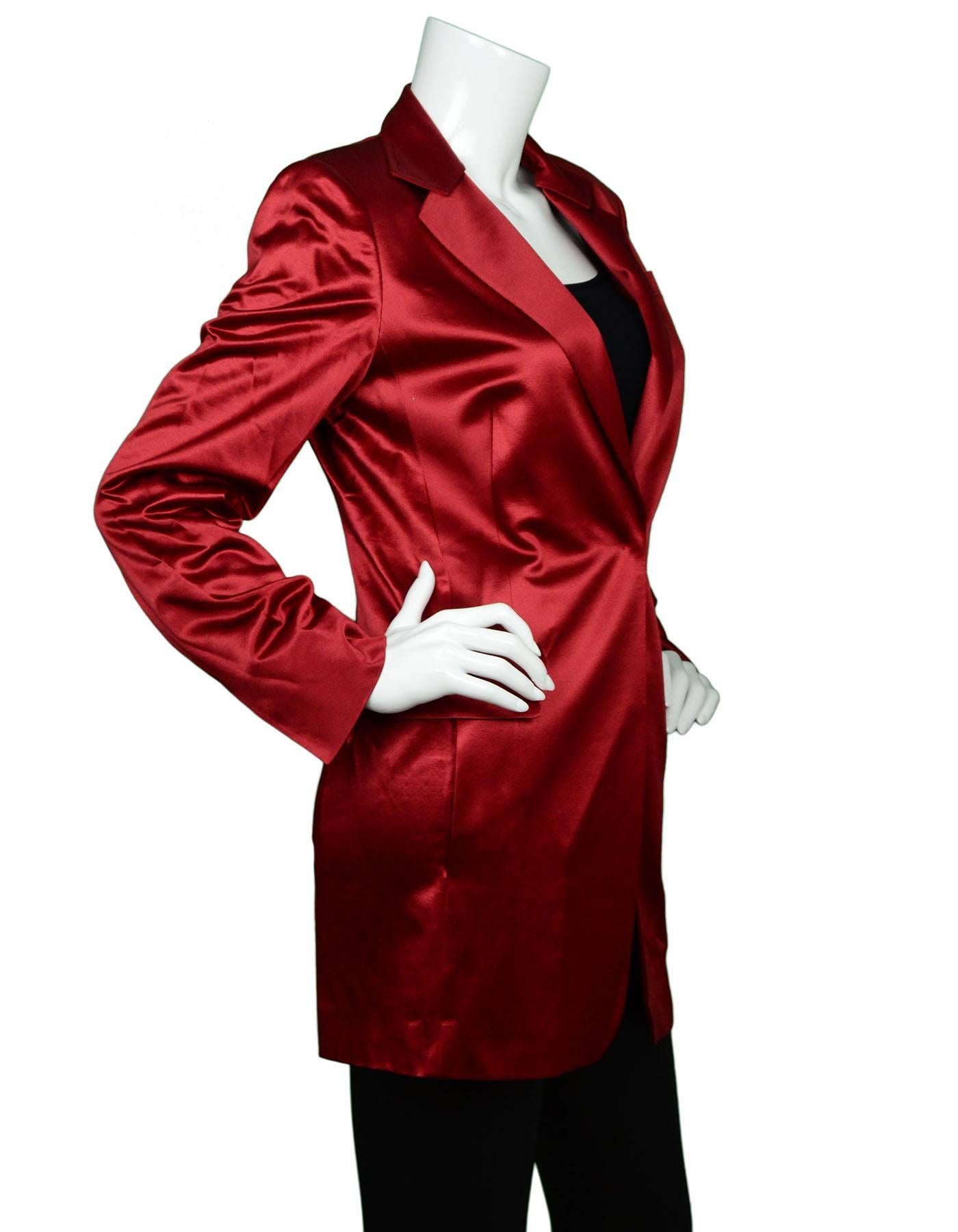 Akris Red Satin Blazer  

Made In: Switzerland
Color: Rust/Burgundy
Composition: 68% wool, 25% silk, 7% nylon
Lining: Rust/Burgundy, 100% silk
Closure/Opening: One snap button closure
Exterior Pockets: Two hip flap pockets
Interior Pockets: