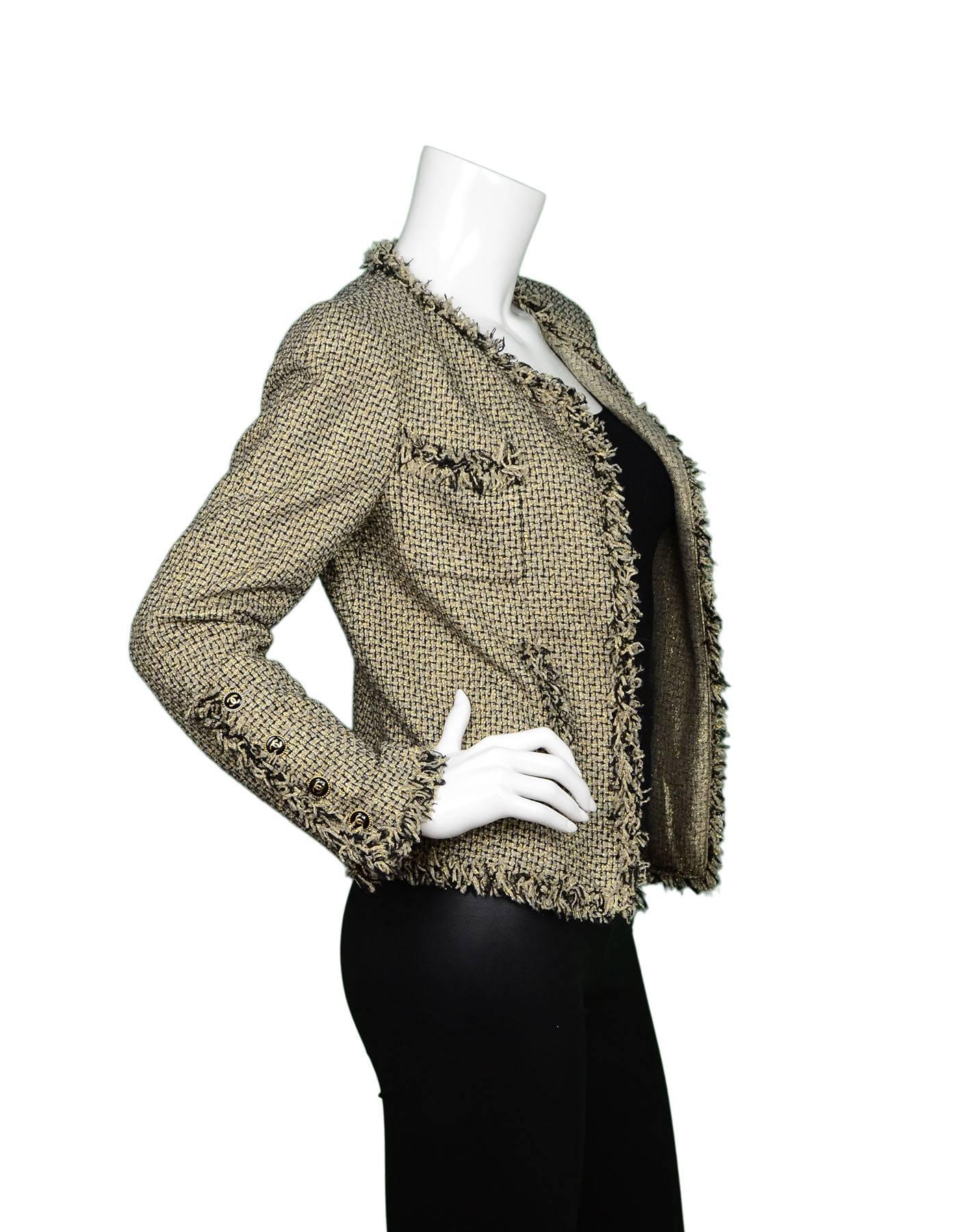 Chanel Black & Gold Tweed Open Jacket  
Features fringe trim throughout

Made In: France
Year of Production: 2007
Color: Black and metallic gold
Composition: 44% acetate, 28% nylon, 14% polyester, 14% silk
Lining: Metallic gold and black, 75%