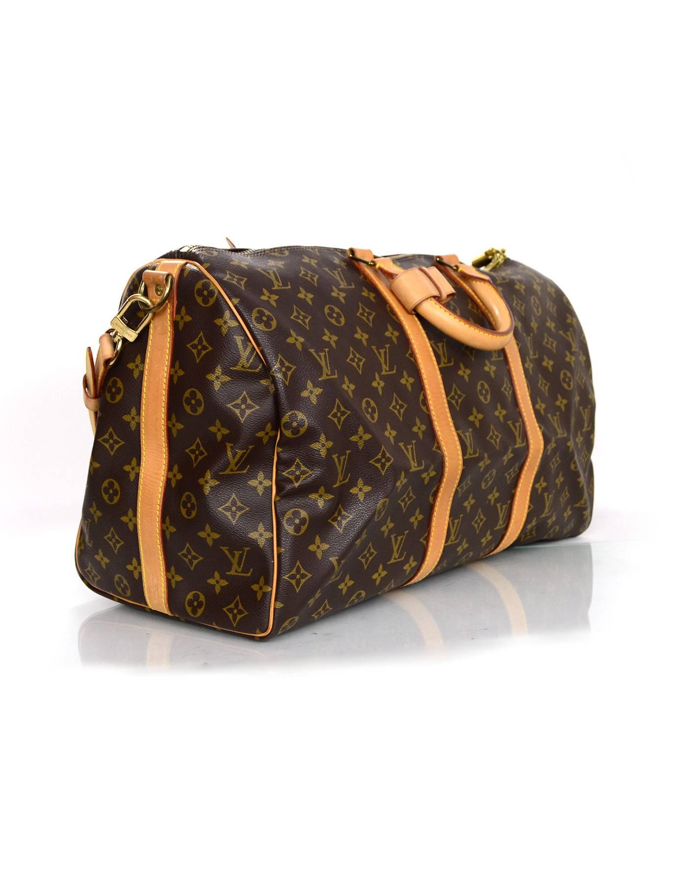 Louis Vuitton Monogram Keepall Bandouliere 50

Made In: France
Year of Production: 1989
Color: Brown and tan
Hardware: Goldtone
Materials: Coated canvas and leather
Lining: Brown canvas
Closure/Opening: zip across top
Exterior pockets: none
Interior
