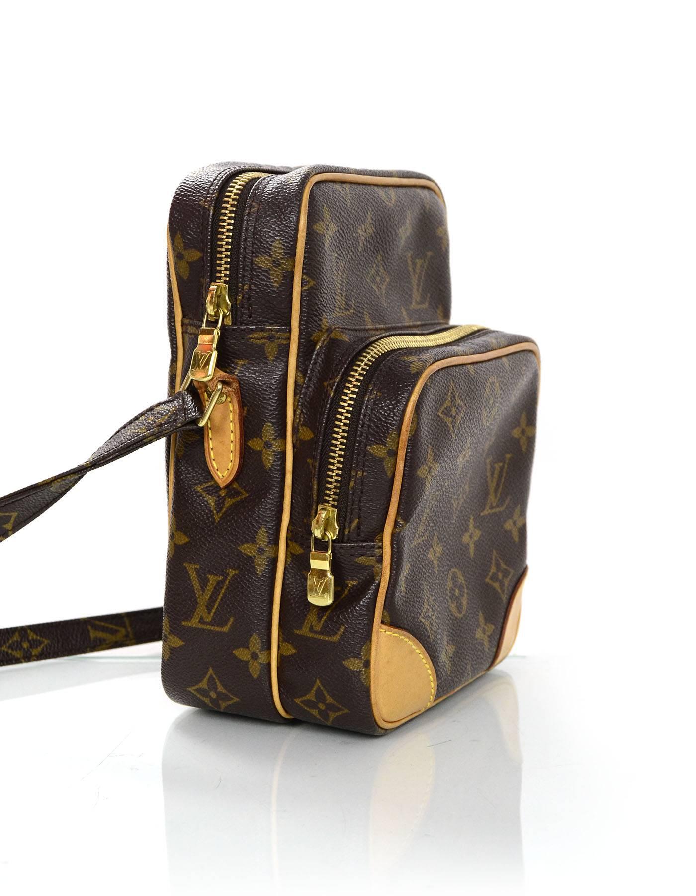 Louis Vuitton Monogram Amazon PM Crossbody Camera Bag

Made In: France
Year of Production: 2002
Color: Brown and tan
Hardware: Goldtone
Materials: Coated canvas and leather
Lining: Brown coated canvas
Closure/Opening: zip around top
Exterior