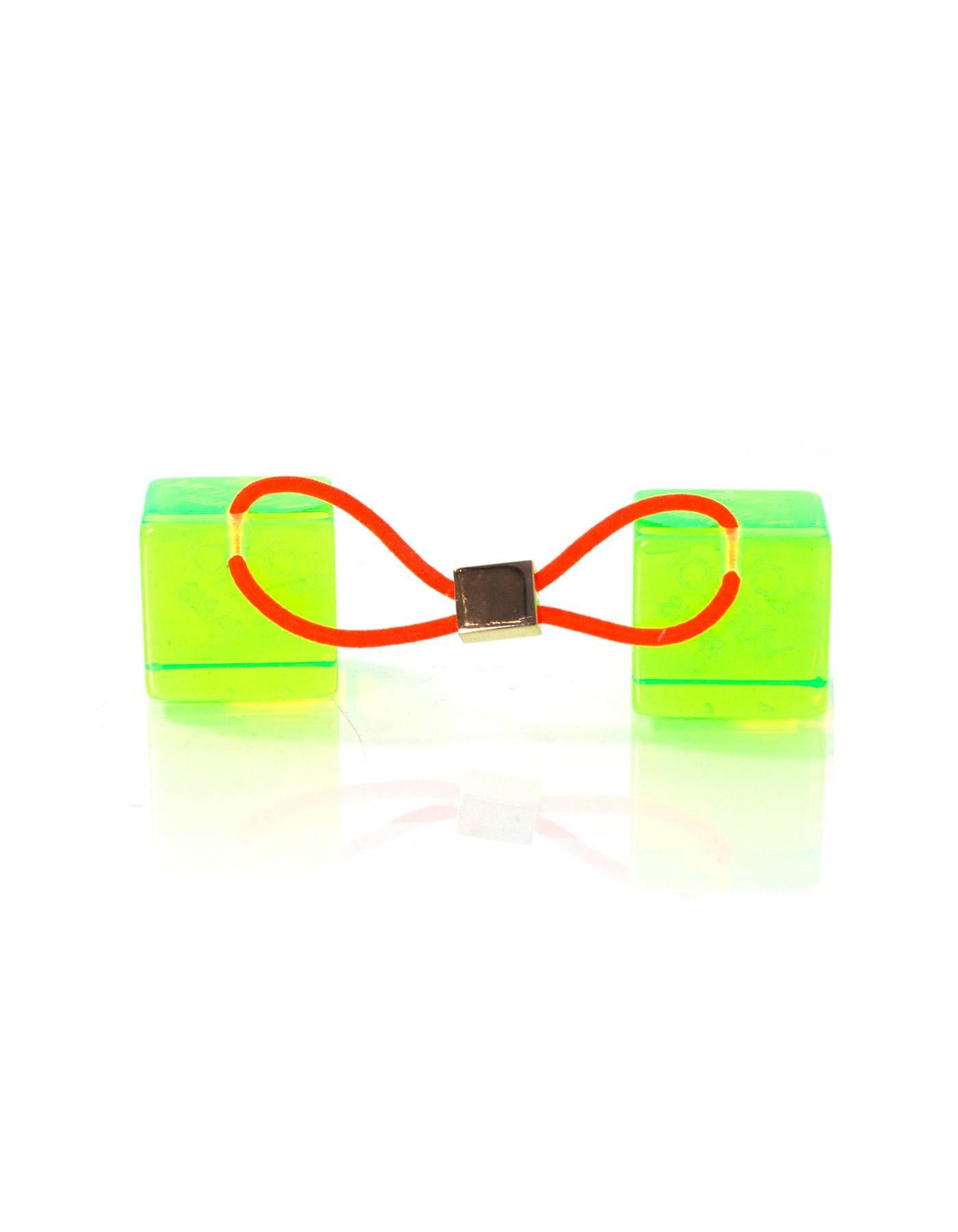 Louis Vuitton Green Hair Cubes

Color: Green
Hardware: Goldtone
Materials: Lucite, brass, elasticized band
Retail Price: $295 + tax
Overall Condition: Excellent pre-owned condition with the exception of some surface marks

Measurements: 
1"L x