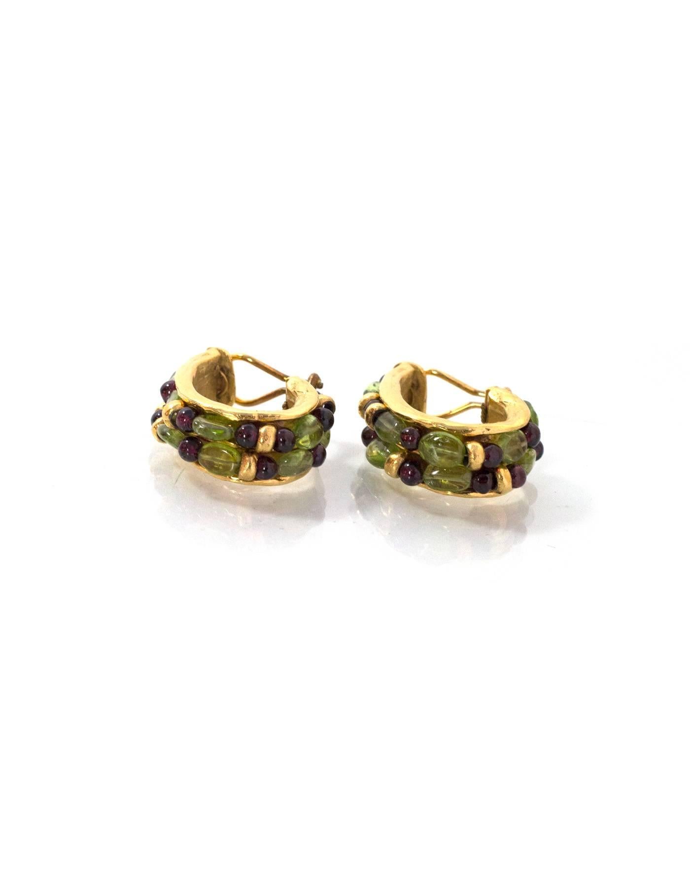 Goossens Paris Green & Red Gripoix Clip-On Earrings

In the 1950's, Robert Goossens worked with Coco Chanel to design jewelry to accompany her fashion designs.  Goossens would create original pieces for Mademoiselle Chanel made of real gold and