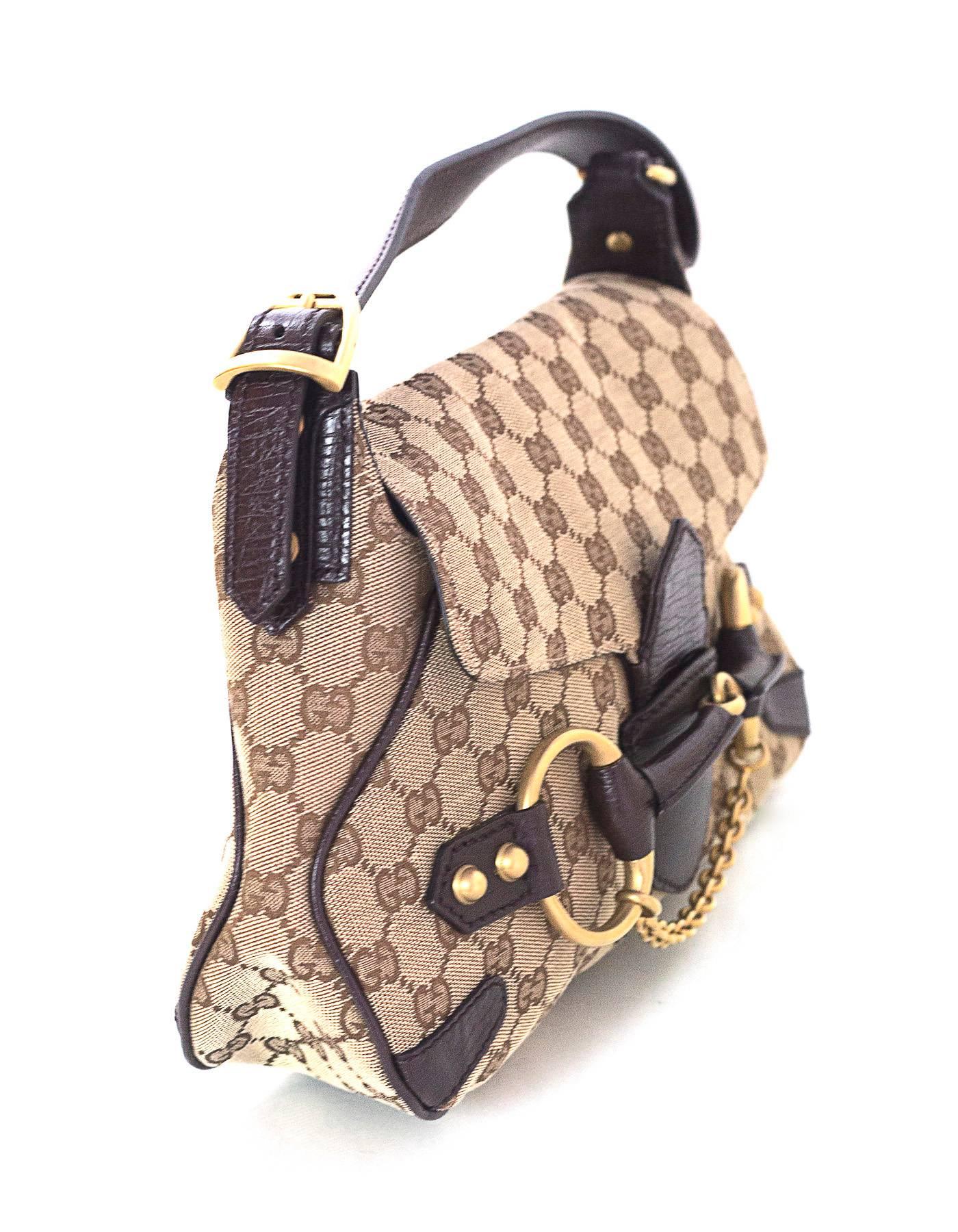 Gucci Monogram Horsebit Flap Bag 
Features adjustable shoulder strap

Made In: Italy
Color: Brown
Hardware: Goldtone
Materials: Canvas and leather
Lining: Brown canvas and leather
Closure/Opening: Flap top with leather arm that slides into
