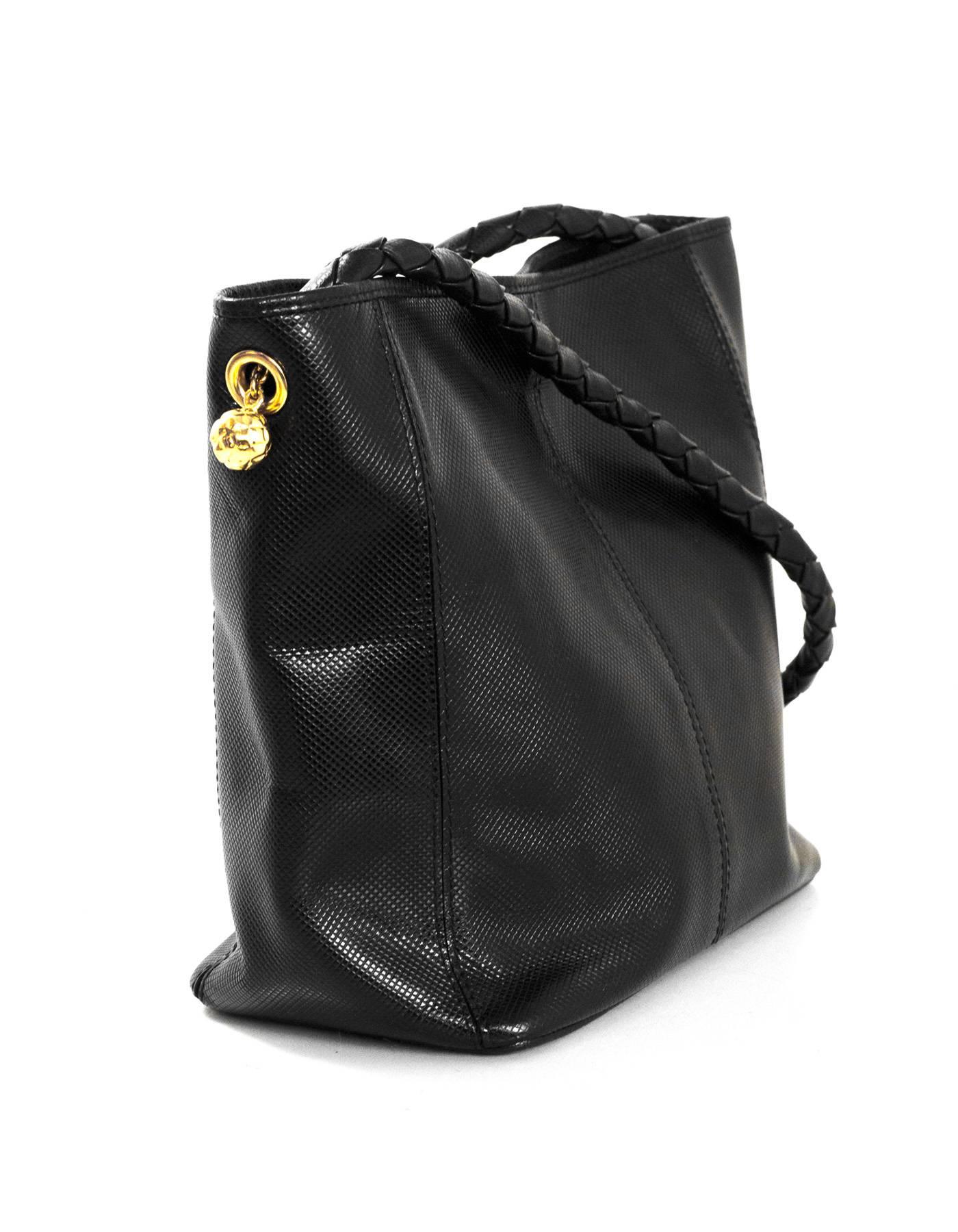 Bottega Veneta Black Textured Leather Bucket Bag

Made In: Italy
Color: Black
Hardware: Goldtone
Materials: Textured leather
Lining: Black textile
Closure/Opening: Open top with center magnetic snap closure
Exterior Pockets: None
Interior Pockets: