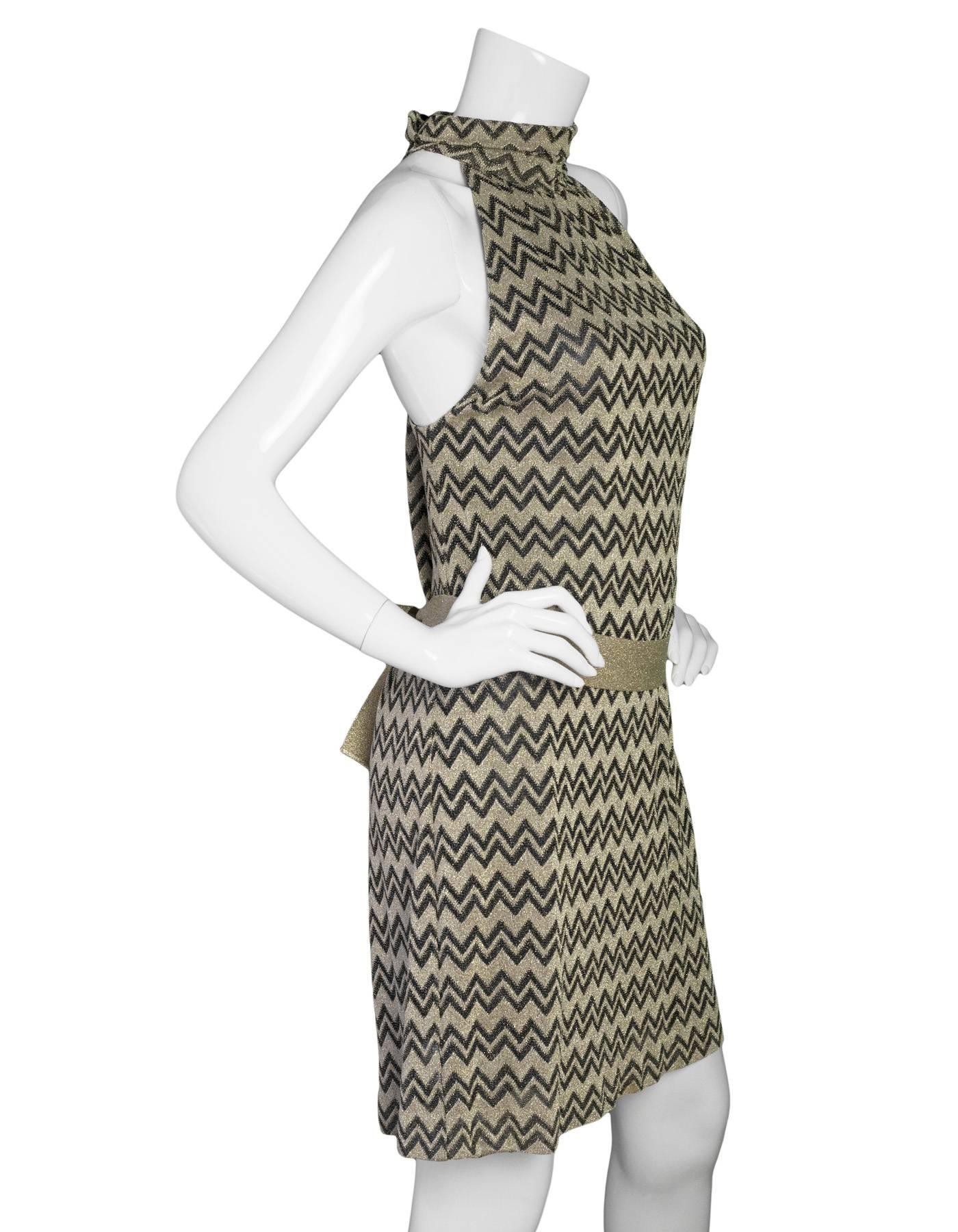 M Missoni Black & Gold Chevron Knit Shift Dress
Features waist tie

Made In: Italy
Color: Black and gold
Composition: 37% viscose, 35% cupro, 19% polyester, 9% polyamide
Lining: Black, 100% polyamide
Closure/Opening: Buttons at back
