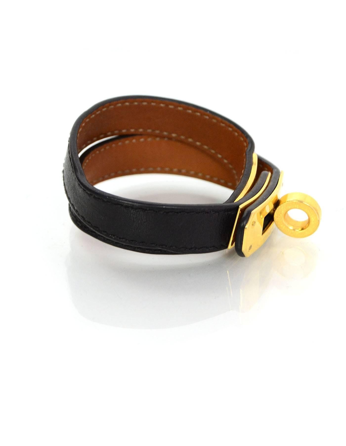 Hermes Black Kelly Double Tour Bracelet

Year of Production: 2011
Color: Black
Hardware: Goldtone
Materials: Leather and metal
Closure: Hook clasp
Stamp: O stamp in square
Retail Price: $510 + tax
Overall Condition: Very good pre-owned condition