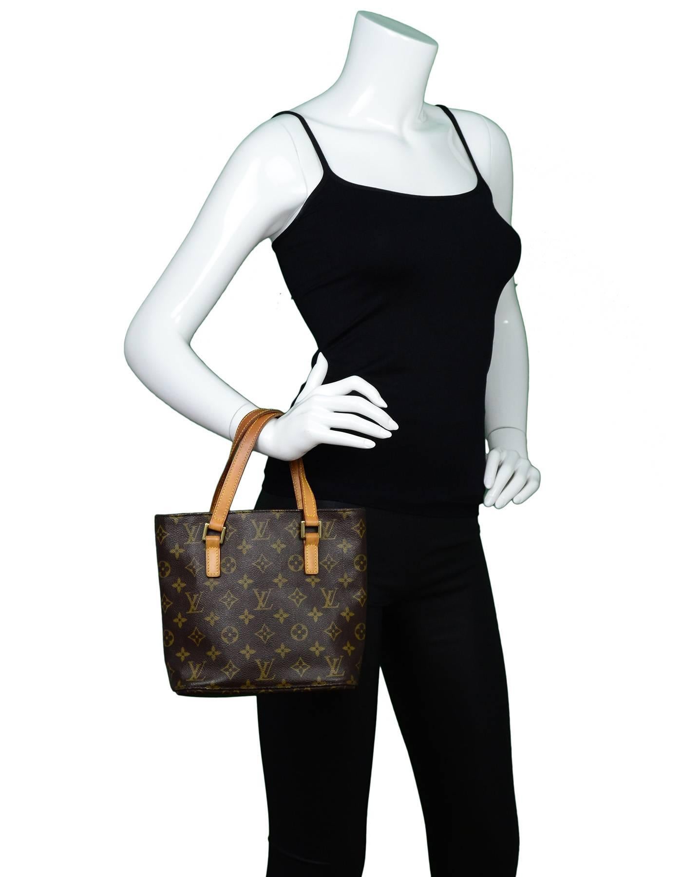 Louis Vuitton Monogram Vavin PM Tote Bag

Made In: U.S.A.
Year of Production: 2001
Color: Brown
Hardware: Goldtone
Materials: Coated canvas and vachetta leather
Lining: Brown canvas
Closure/Opening: None
Exterior Pockets: None
Interior Pockets: Two