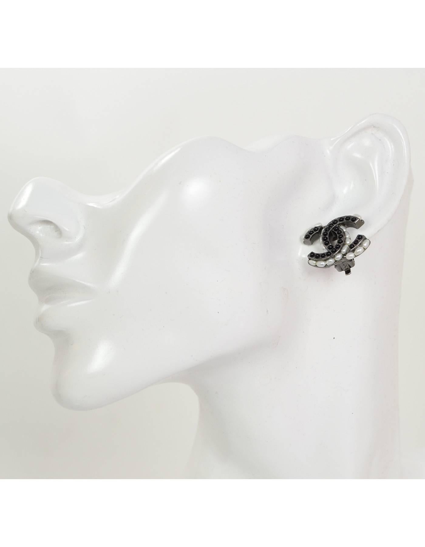 Chanel Black and Ivory Faux Pearl CC Clip-On Earrings

Made In: France
Year of Production: 2015
Color: Black and ivory
Materials: Faux pearl and metal
Closure: Clip on
Stamp: Chanel A15 CC B Made in France
Overall Condition: Excellent pre-owned