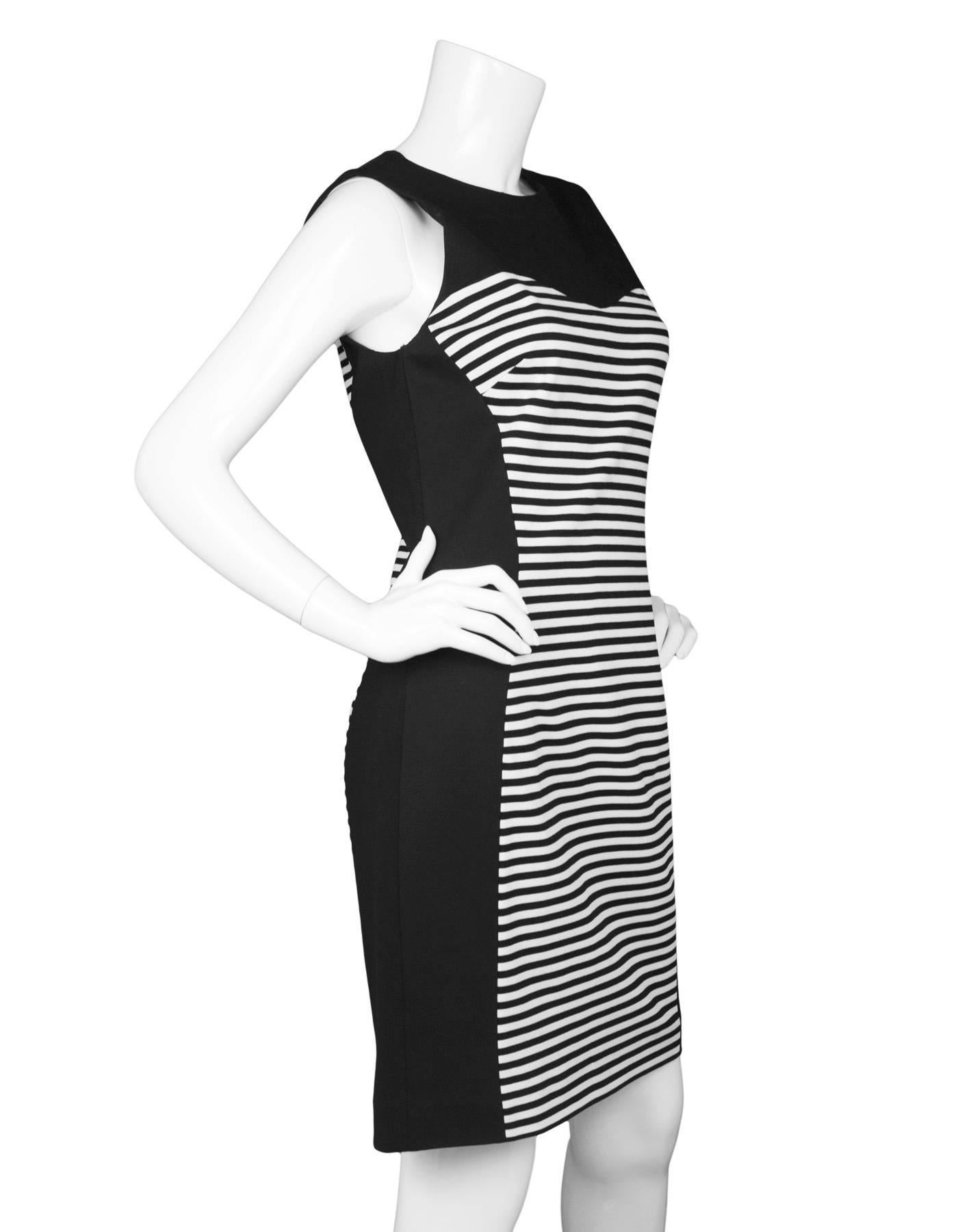 Michael Kors Black & White Stripe Sheath Dress 

Made In: Italy
Color: Black and white
Composition: Not given- believed to be a poly-blend
Lining: Black, poly-blend
Closure/Opening: Back zip up
Exterior Pockets: None
Interior Pockets: