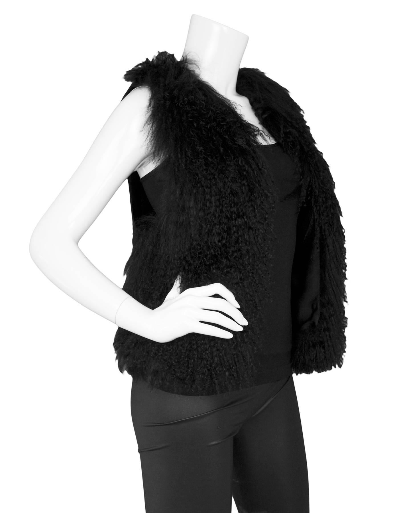 Michael Michael Kors Black Mongolian Lamb Fur Vest 
Features fabric back panel and mongolian lamb fur front panels

Made In: China
Color: Black
Composition: 100% Mongolian lamb fur and 10% polyester
Lining: Black, 100% polyester
Closure/Opening: