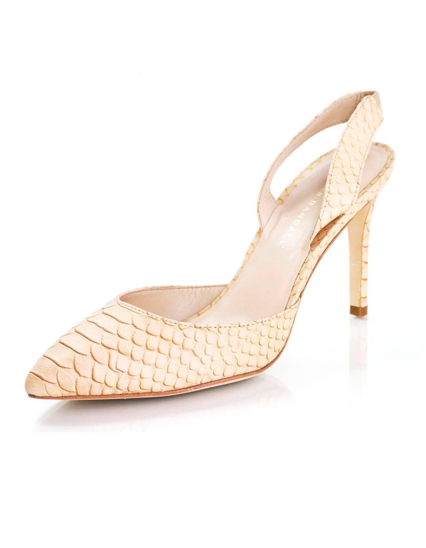 Loeffler Randall Nude Snakeskin Slingback Pumps Sz 9

Made In: Brazil
Color: Nude
Materials: Embossed leather
Closure/Opening: Slingback strap
Sole Stamp: Loeffler Randall vero cuoio 9 B
Overall Condition: Excellent pre-owned condition, minor wear
