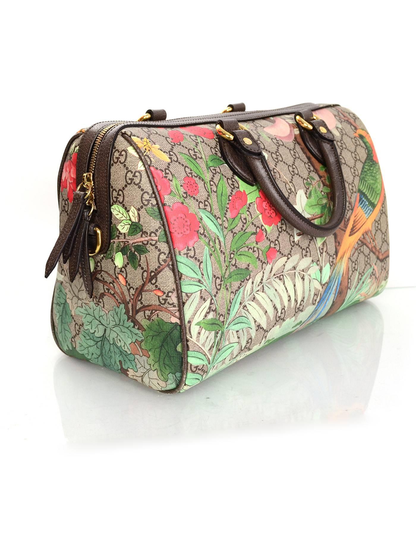 Gucci Monogram Tian Supreme Boston Bag
Features features flowers and bird printed over monogram

Made In: Italy
Color: Brown/taupe and multi-colored
Hardware: Goldtone
Materials: Leather and coated canvas
Lining: Light brown