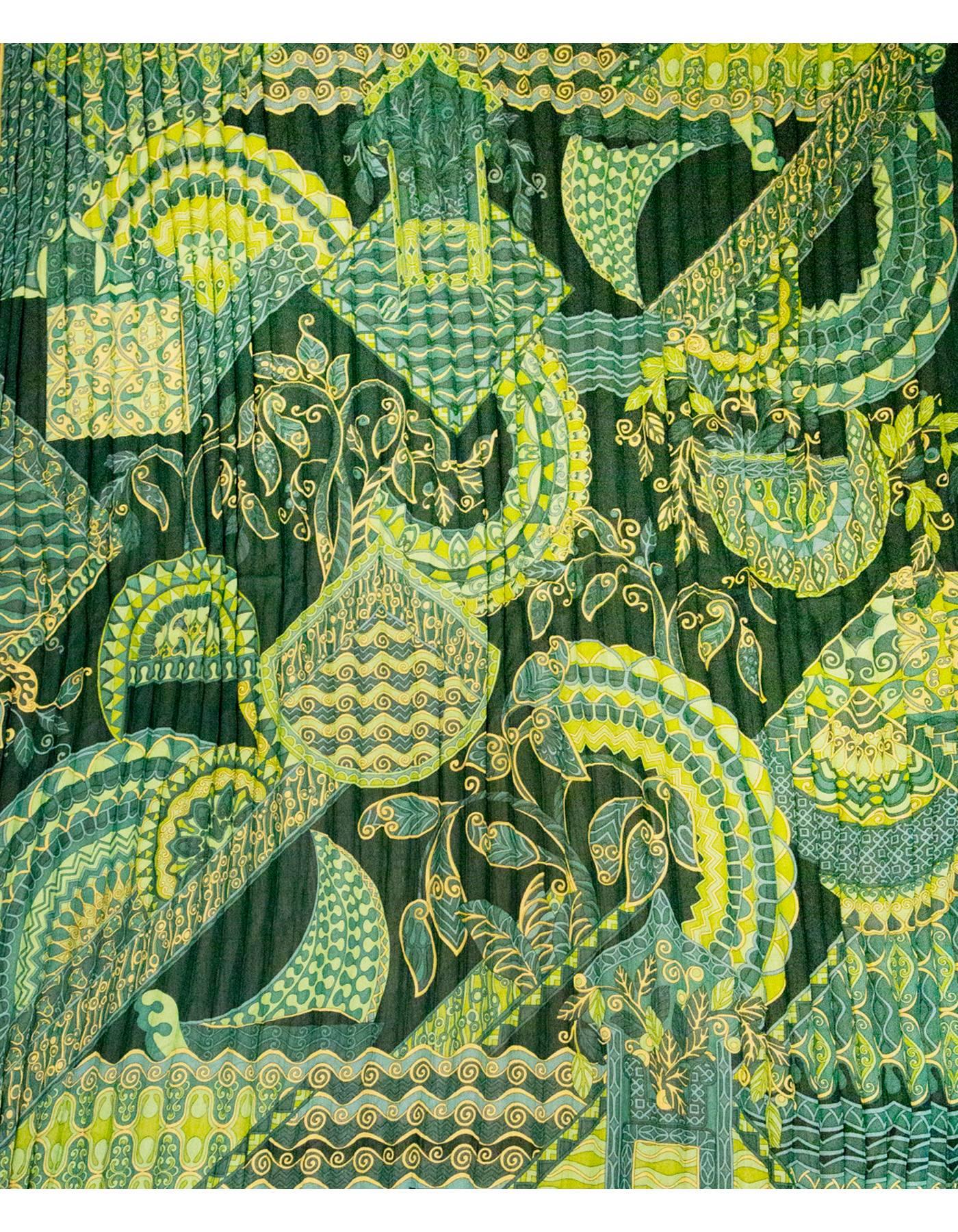 Salvatore Ferragamo Green & Gold Micro Pleated Silk Scarf 
Features leaf designs printed throughout

Made In: Italy
Color: Green and gold
Composition: 100% silk
Overall Condition: Excellent pre-owned condition
Measurements: 
Length: