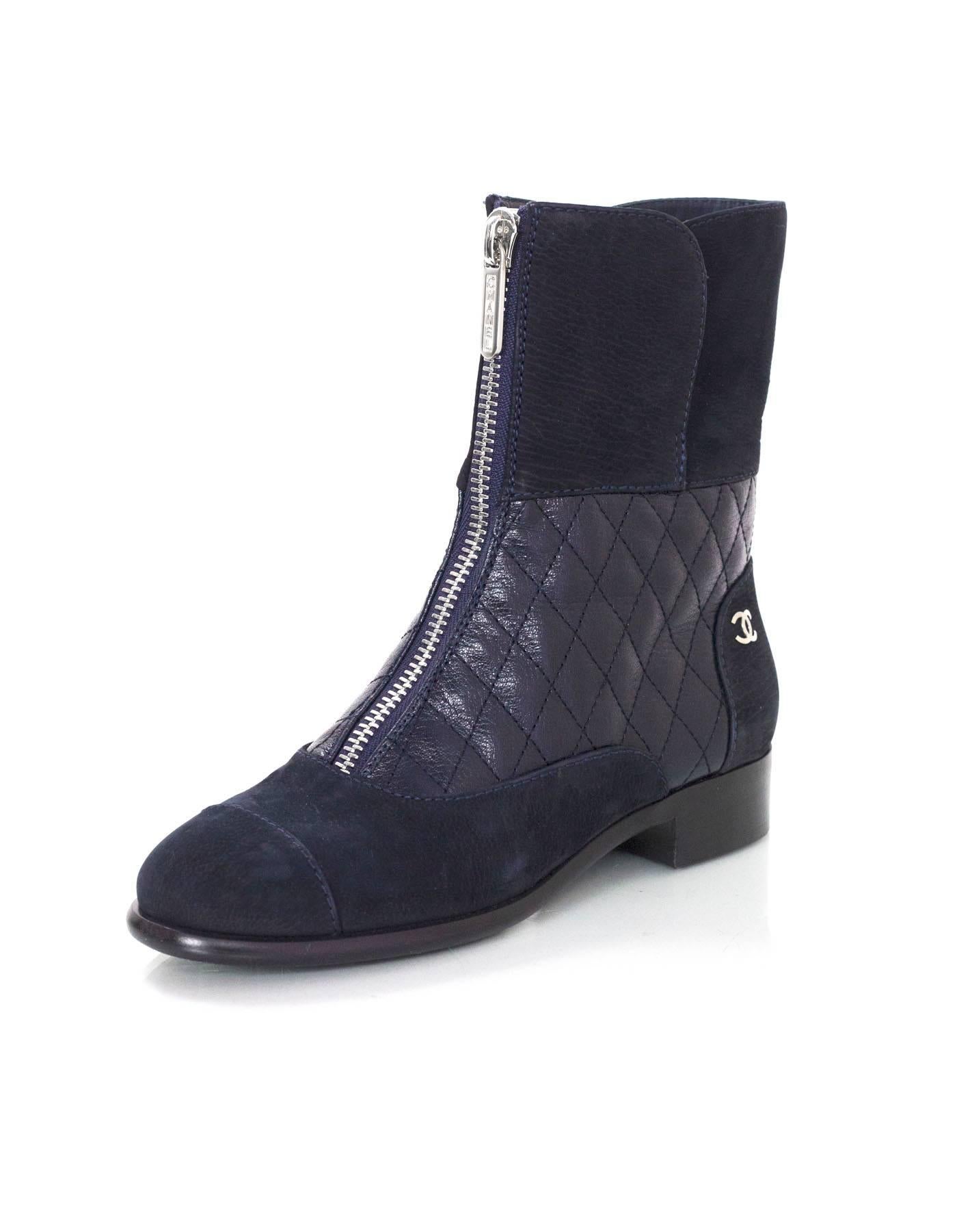 Chanel Navy Suede & Quilted Leather Zip Front Boots
Features small silvertone CC's at outside of heel cap

Made In: Italy
Year of Production: 2016
Color: Navy
Materials: Leather and suede
Closure/Opening: Pull on and zip up front
Sole Stamp: CC
