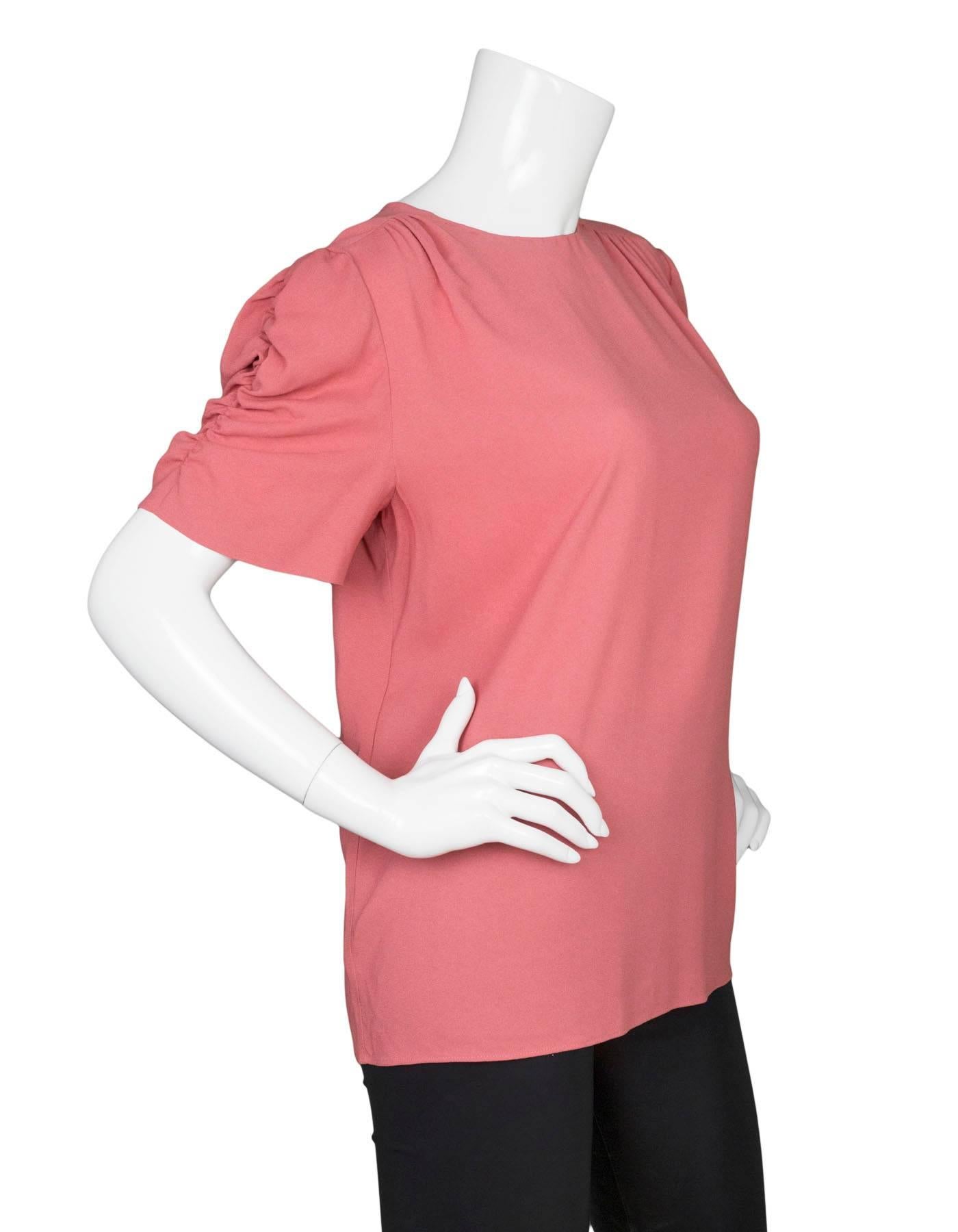 Miu Miu Rose Silk Short Sleeve Top 
Features ruched sleeves

Made In: Italy
Color: Pink rose
Composition: 98% viscose, 2% elastane
Lining: Pink rose, 100% polyester
Closure/Opening: Back button down
Exterior Pockets: None
Interior Pockets: