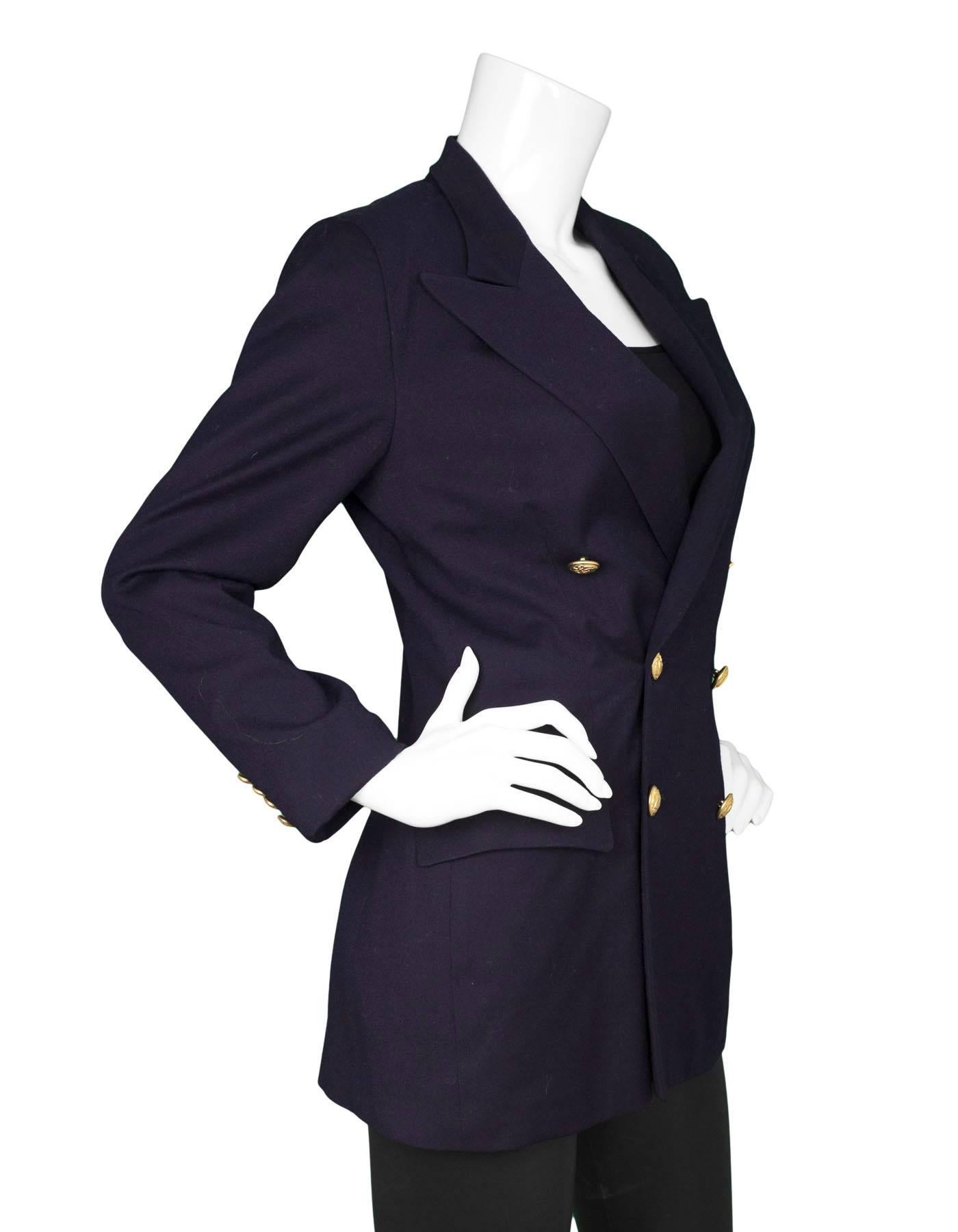 Ralph Lauren Navy Wool Double Breasted Jacket
Features goldtone nautical detailed buttons

Made In: USA
Color: Navy
Composition: 100% wool
Lining: Navy, silk-blend
Closure/Opening: Double breasted button down
Exterior Pockets: Two hip flap
