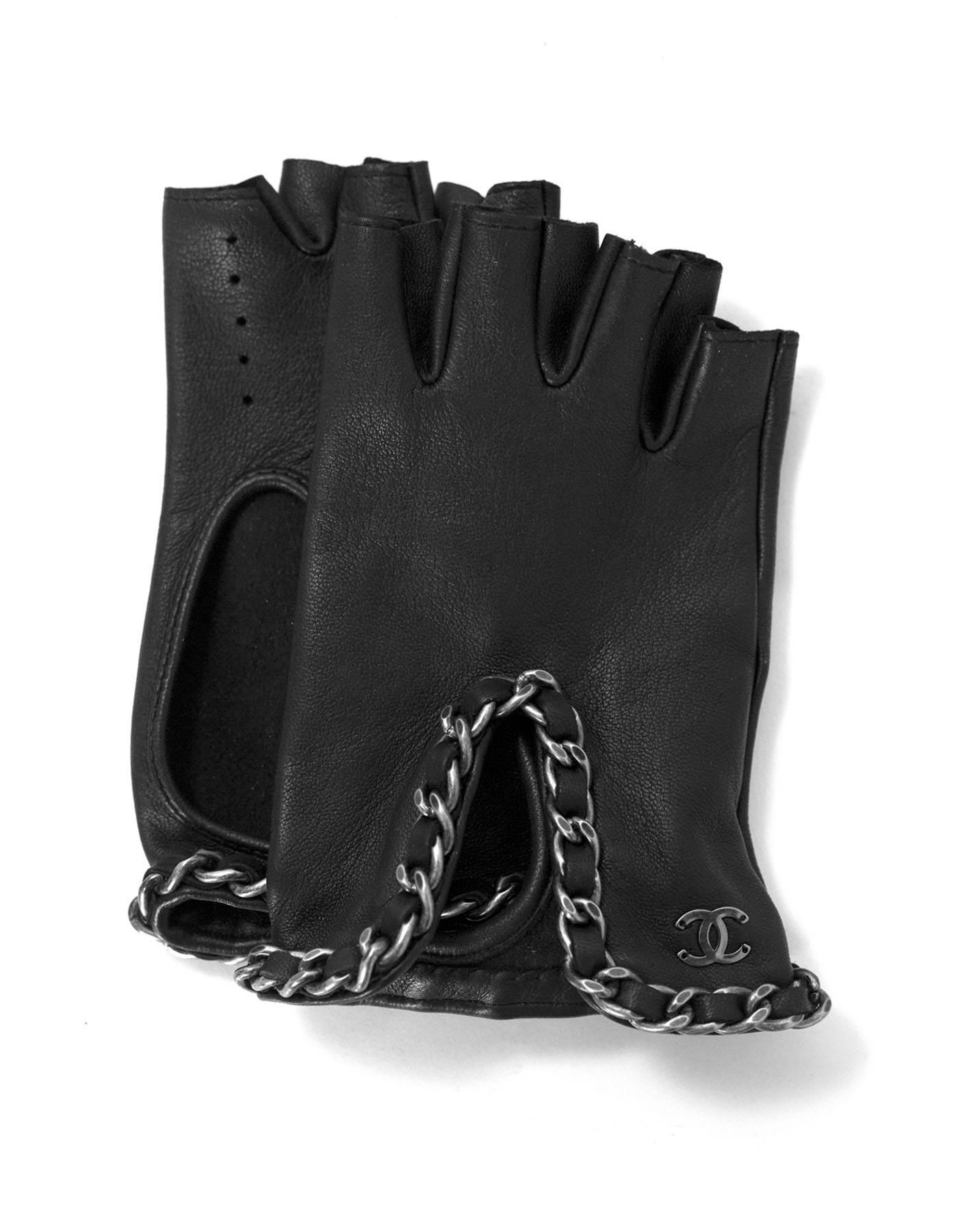 Chanel Black Leather Chain Finger-less Gloves Sz 7

Made In: France
Color: Black
Materials: Leather
Closure: None
Retail Price: $950 + tax
Overall Condition: Excellent pre-owned condition
Includes: Chanel tag
Marked Size: 7