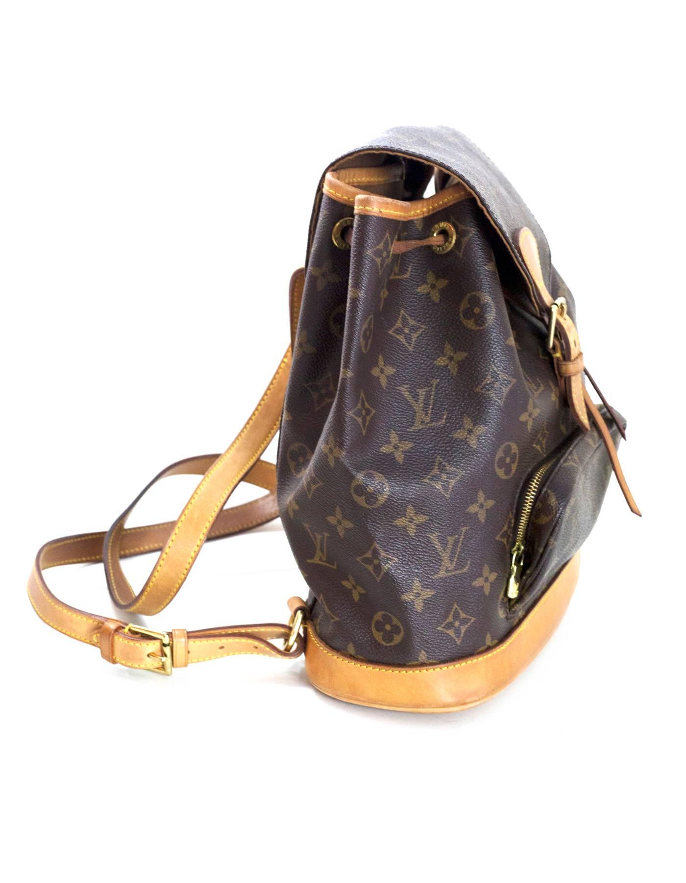 Louis Vuitton Monogram Montsouris MM Backpack
Features leather trim throughout and adjustable shoulder straps

Made In: France
Year of Production: 2001
Color: Brown
Hardware: Goldtone
Materials: Leather and coated canvas
Lining: Brown