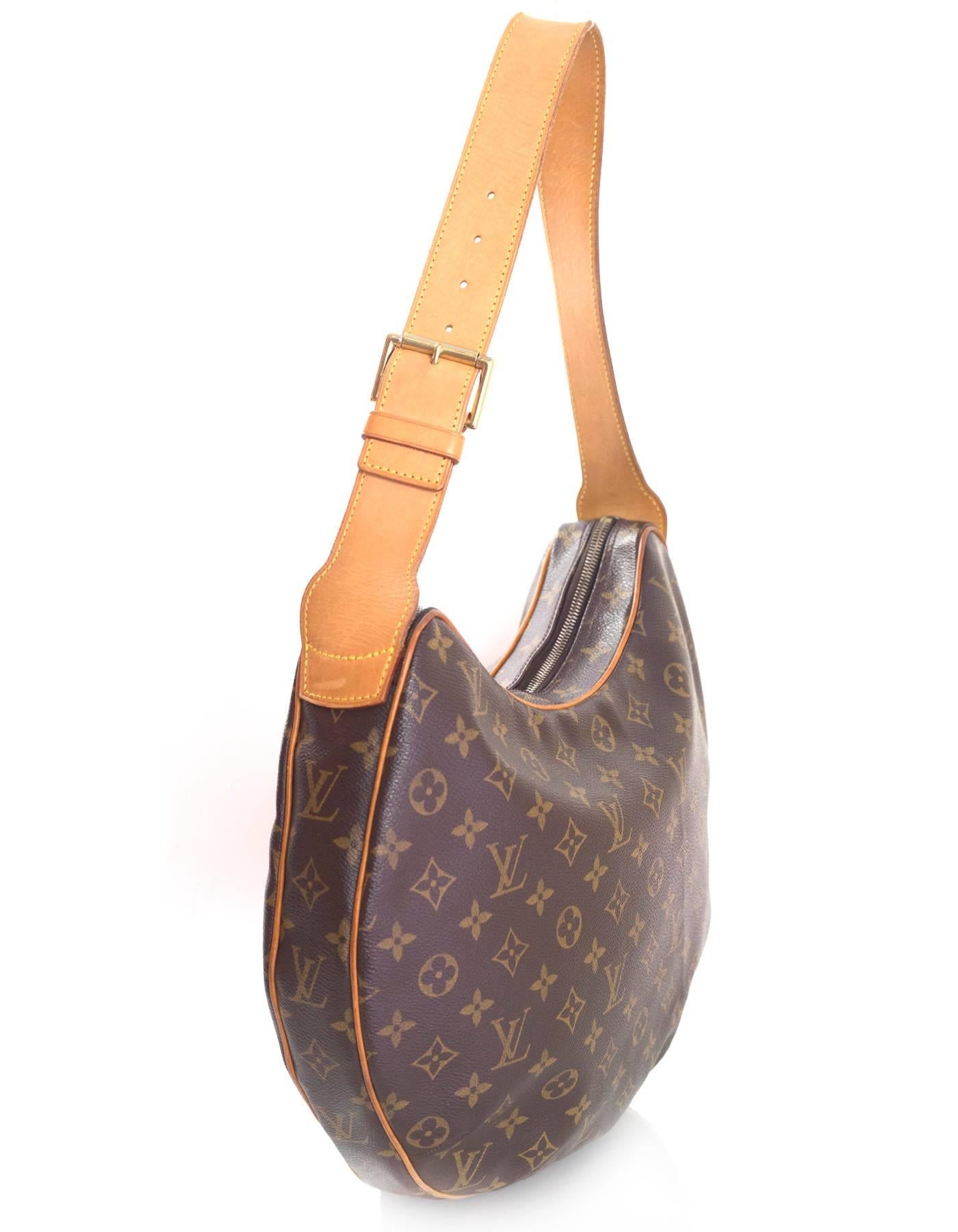 Louis Vuitton Monogram Croissant GM Bag
Features adjustable leather handles and leather piping

Made In: Spain
Year of Production: 2003
Color: Brown and tan
Hardware: Goldtone
Materials: Coated canvas and leather
Lining: Red