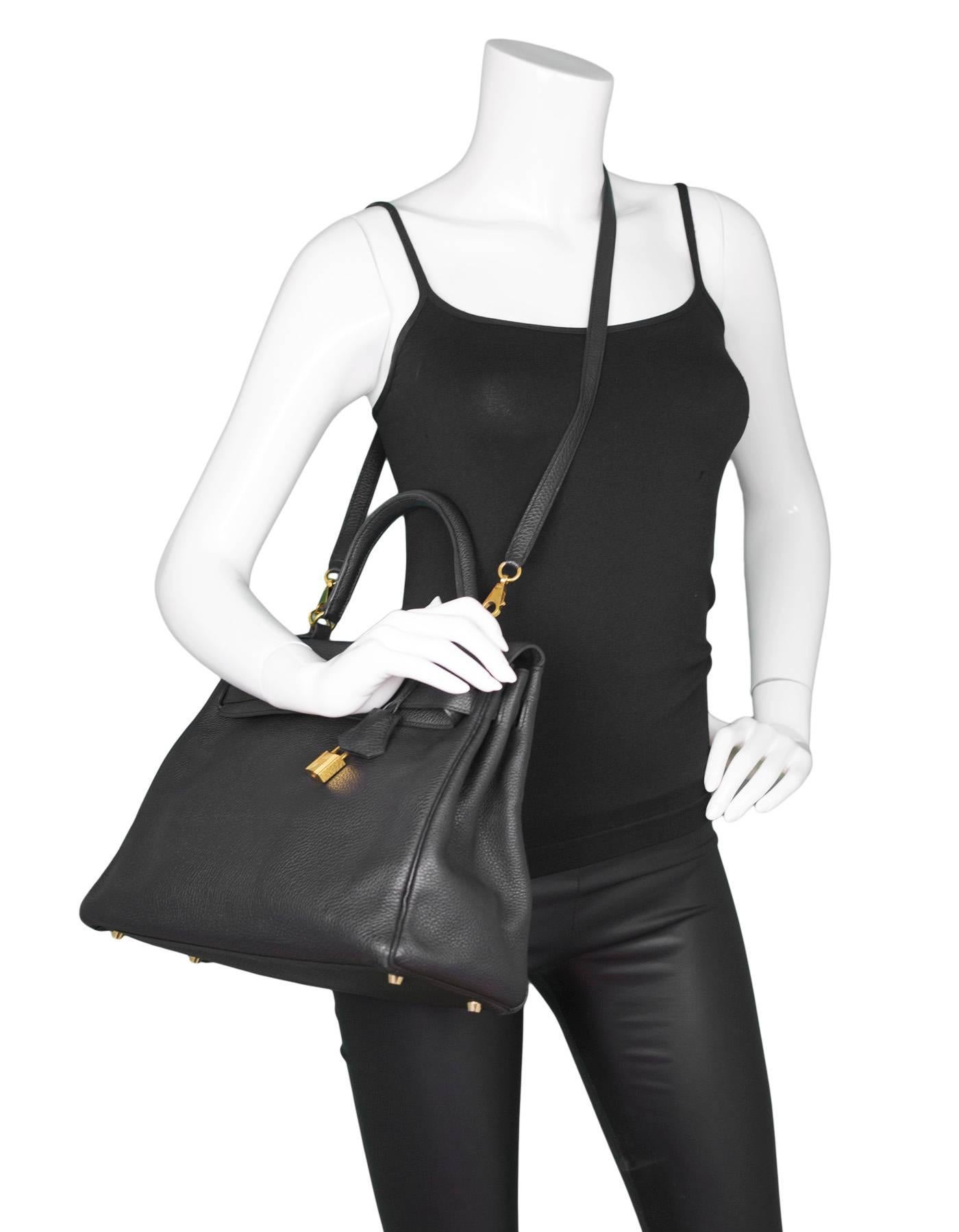 Hermes Black Togo 35cm Kelly Bag 
Features removable shoulder/crossbody strap

Made In: France
Year of Production: 2013
Color: Black
Hardware: Goldtone
Materials: Togo leather, metal
Lining: Black leather
Closure/opening: Flap top with two leather