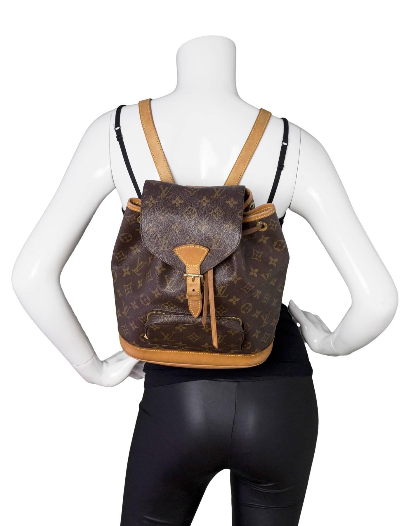 Louis Vuitton Monogram Montsouris MM Backpack
Features leather trim throughout and adjustable shoulder straps

Made In: France
Year of Production: 2000
Color: Brown
Hardware: Goldtone
Materials: Leather and coated canvas
Lining: Brown