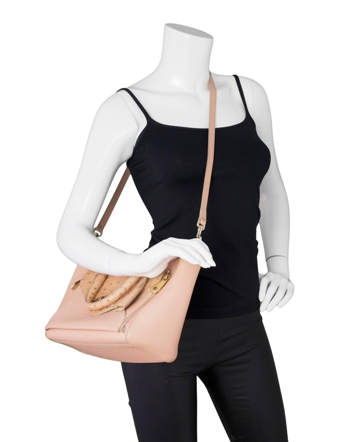 Mulberry Pink Leather and Ostrich Small Willow Tote
Front pocket can zip off and be used as a clutch

Made In: England
Color: Pink
Hardware: Goldtone
Materials: Leather, ostrich, metal
Lining: Beige suede
Closure/Opening: Open top with center snap