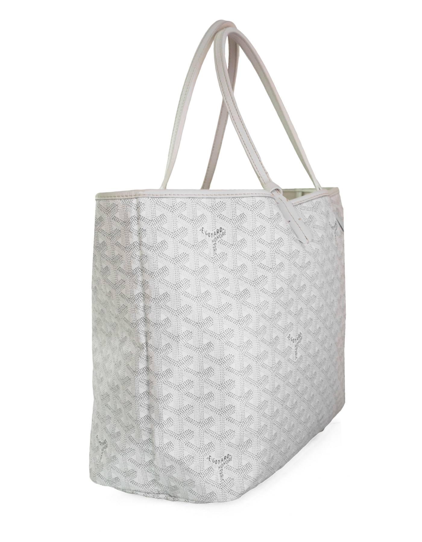 Goyard White St. Louis PM Chevron Tote

Made In: France
Colors: White
Hardware: Silvertone 
Materials: Coated canvas, leather
Lining: Cream textile
Closure/Opening: Open top
Exterior Pockets: None
Interior Pockets: Small attached pochette
Overall