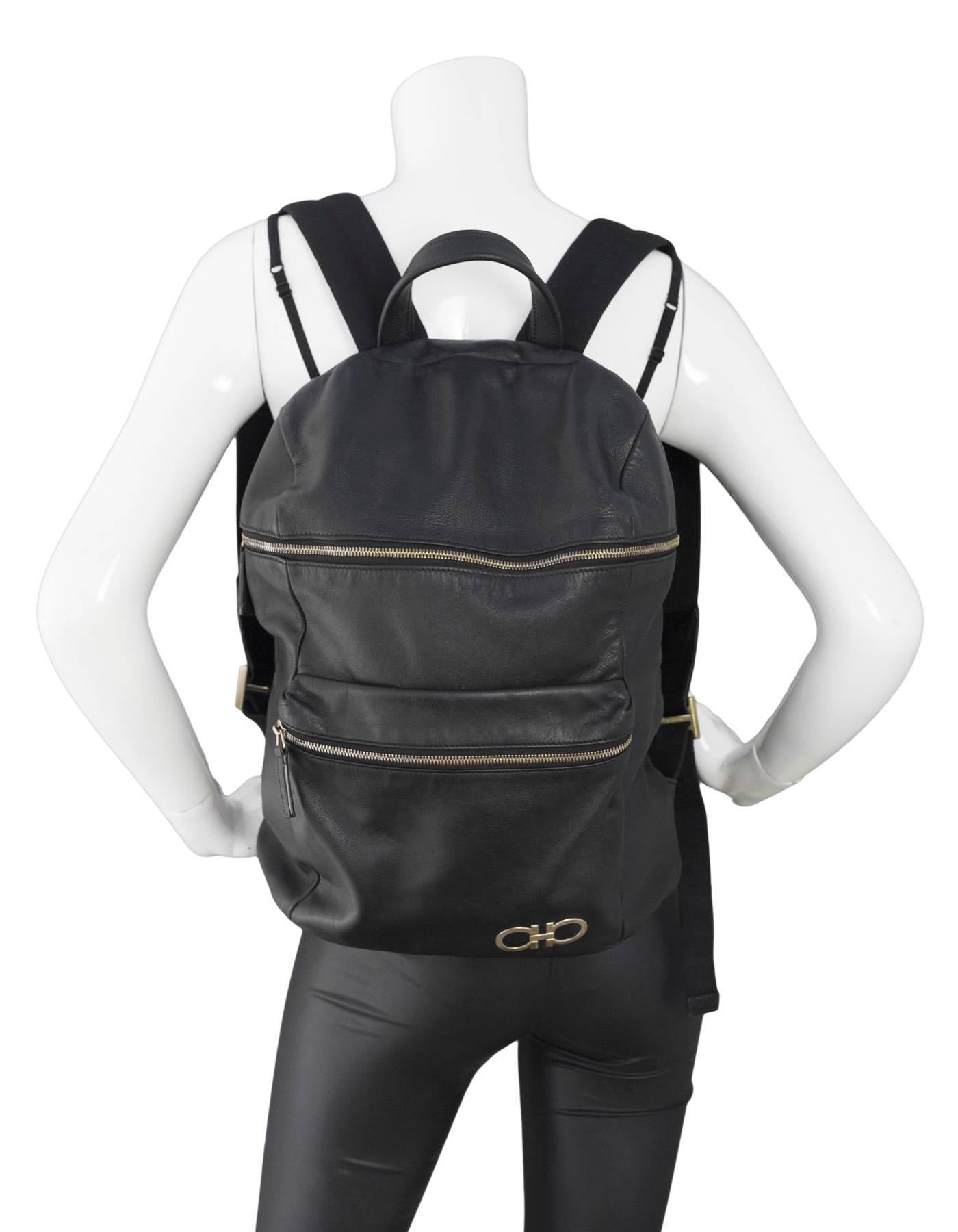 Salvatore Ferragamo Black Nevada Gancini Backpack

Made In: Italy
Hardware: Goldtone
Materials: Leather and metal
Lining: Black textile
Closure/Opening: Zip closure
Exterior Pockets: One front zip pocket
Interior Pockets: One zip wall pocket
Retail