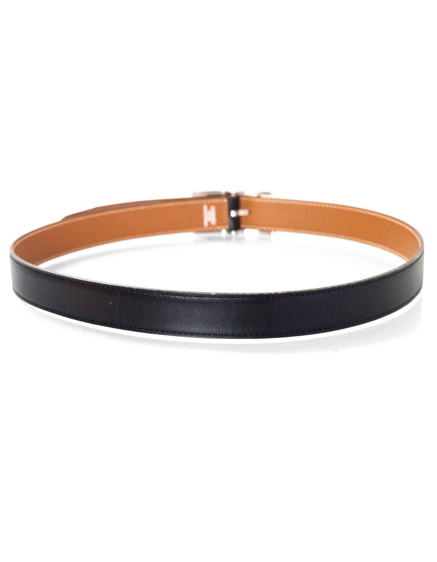 Hermes Black & Tan Reversible Hapi H Belt 

Made In: France
Year of Production: 1997
Color: Tan and black
Hardware: Palladium
Materials: Leather
Closure/Opening: Buckle and notch closure
Stamp: A stamp in square
Overall Condition: Very good