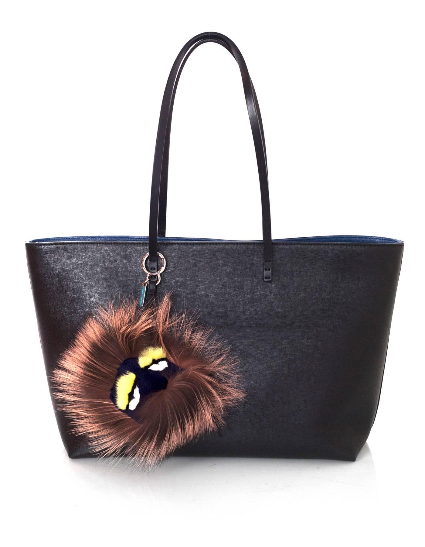 Fendi Taupe Mink & Fox Fur Bag Bug Charm - NIB

Made In: Italy
Color: Taupe, navy
Hardware: Silvertone
Materials: Fox, mink
Closure/Opening: Jump ring push lever
Retail Price: $850 + tax
Overall Condition: Excellent- NEW
Includes: Fendi box and