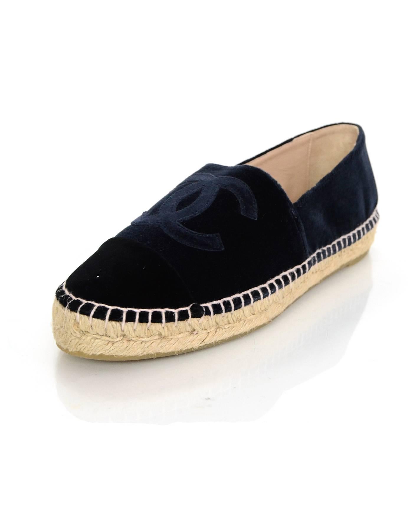Chanel Navy Velvet Espadrilles Sz 39 NIB

Made In: Spain
Color: Navy
Materials: Velvet, jute rope
Closure/Opening: Slide on
Sole Stamp: Made in Spain 39 Chanel CC
Overall Condition: Excellent pre-owned condition - NIB
Included: Chanel box, dust