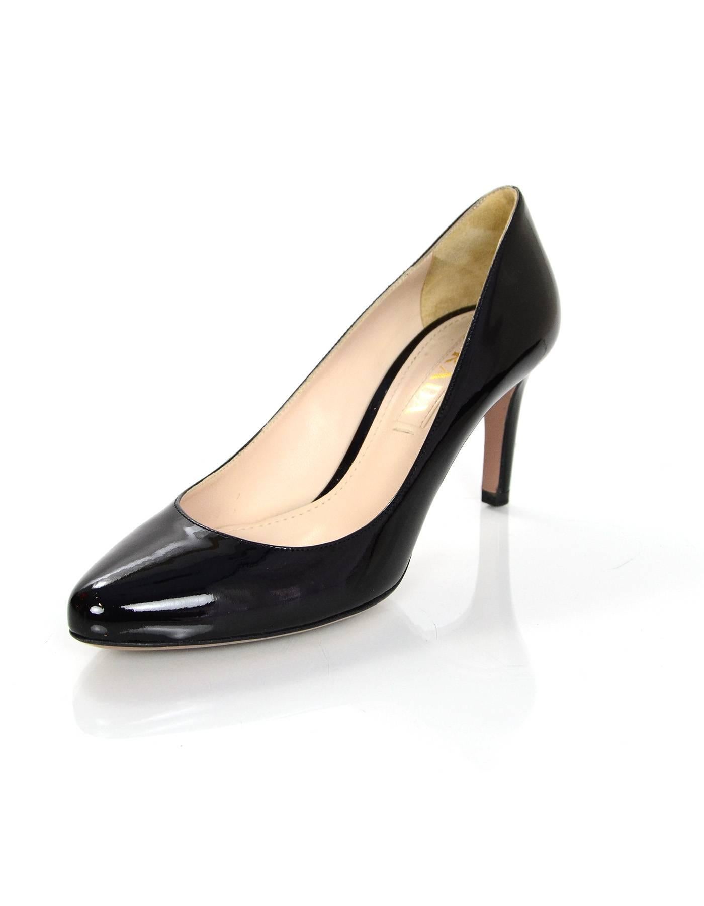 Prada Black Patent Almond Toe Pumps Sz 35.5

Made in: Italy
Color: Black
Materials: Patent leather
Closure/opening: Slide on
Sole Stamp: Prada 35.5 Made in Italy
Overall Condition: Excellent pre-owned condition with the exception of minor wear at