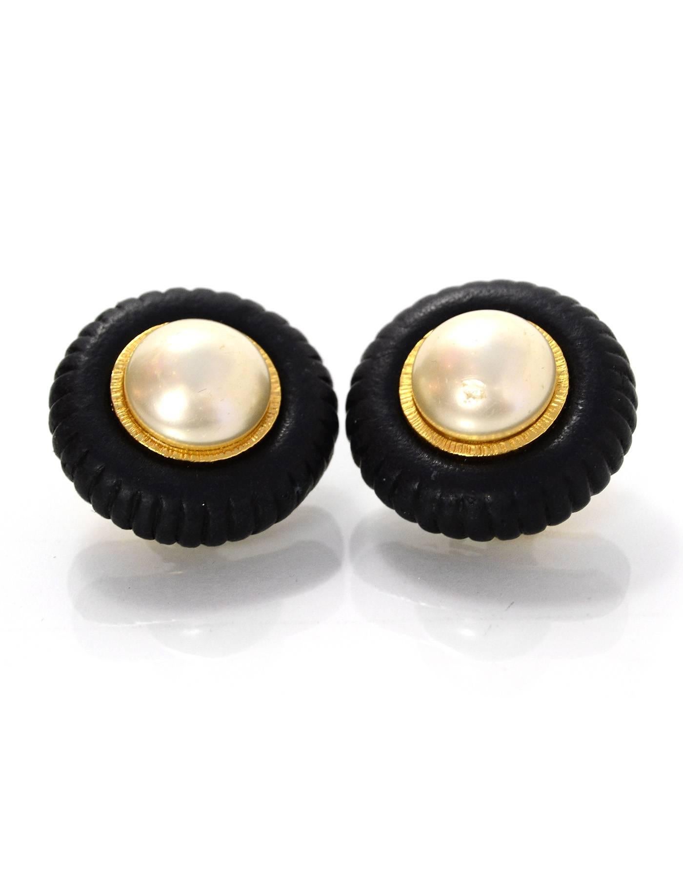 Chanel Black and Pearl Clip-On Earrings

Color: Goldtone, black, cream
Materials: Metal, faux pearl
Closure: Clip on
Stamp: Chanel 
Overall Condition: Excellent vintage, pre-owned condition with minor surface marks

Measurements: 
Diameter: