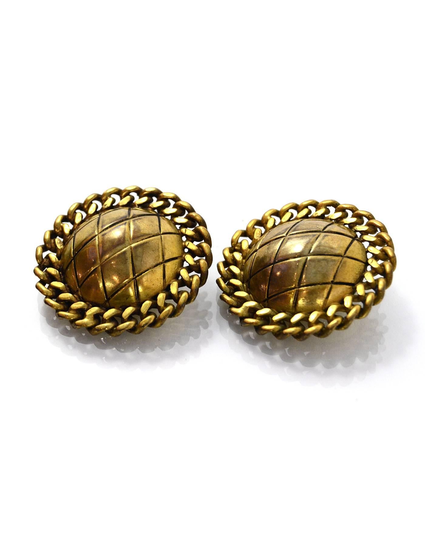 Chanel Goldtone Quilted Clip-On Earrings

Color: Goldtone
Materials: Metal
Closure: Clip on
Stamp: Chanel 
Overall Condition: Excellent vintage, pre-owned condition with minor surface marks

Measurements: 
Diameter: 1.25"